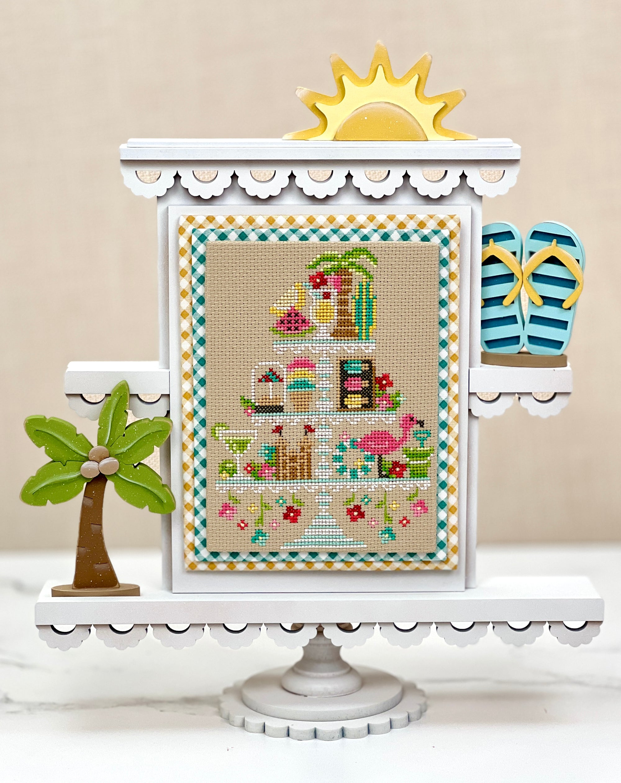 Summer themed faux tiered tray cross stitch display with a finished cross stitch by Erin Elizabeth designs.