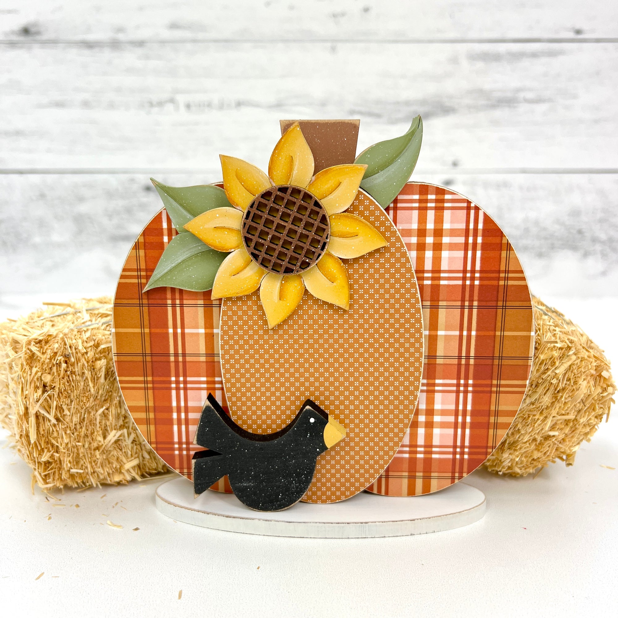 Small fall pumpkin wood decor craft kit with a sunflower, black crow, and plaid printed pumpkin