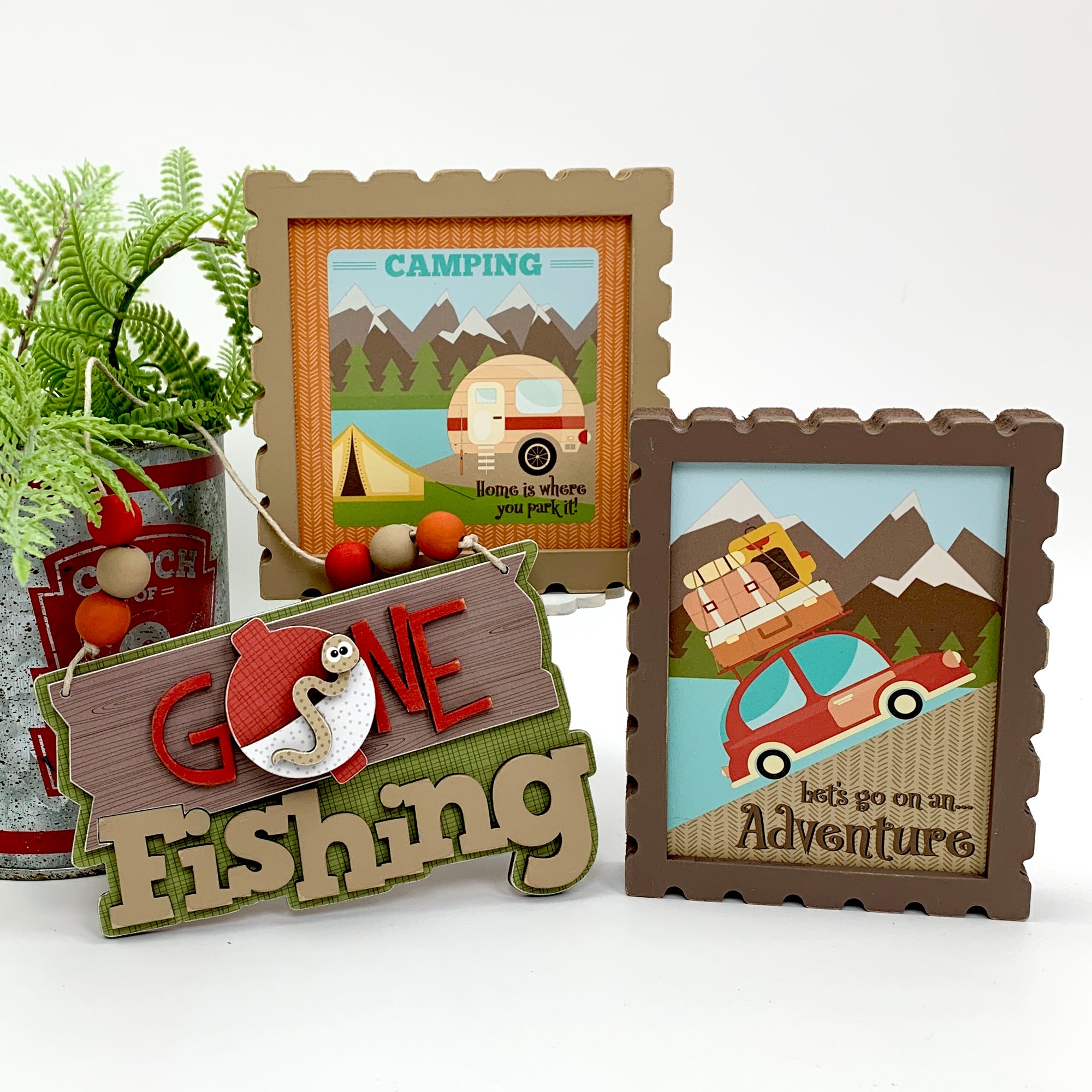 Gone fishing sign with a camping sign and let's go on an adventure sign for outdoor and camping tiered tray decorating