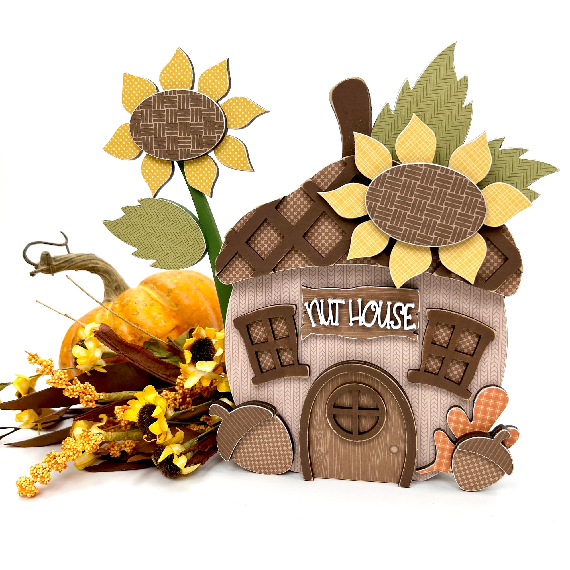 Wood acorn and sunflower decoration craft kit. Acorn is designed to look like a house. 