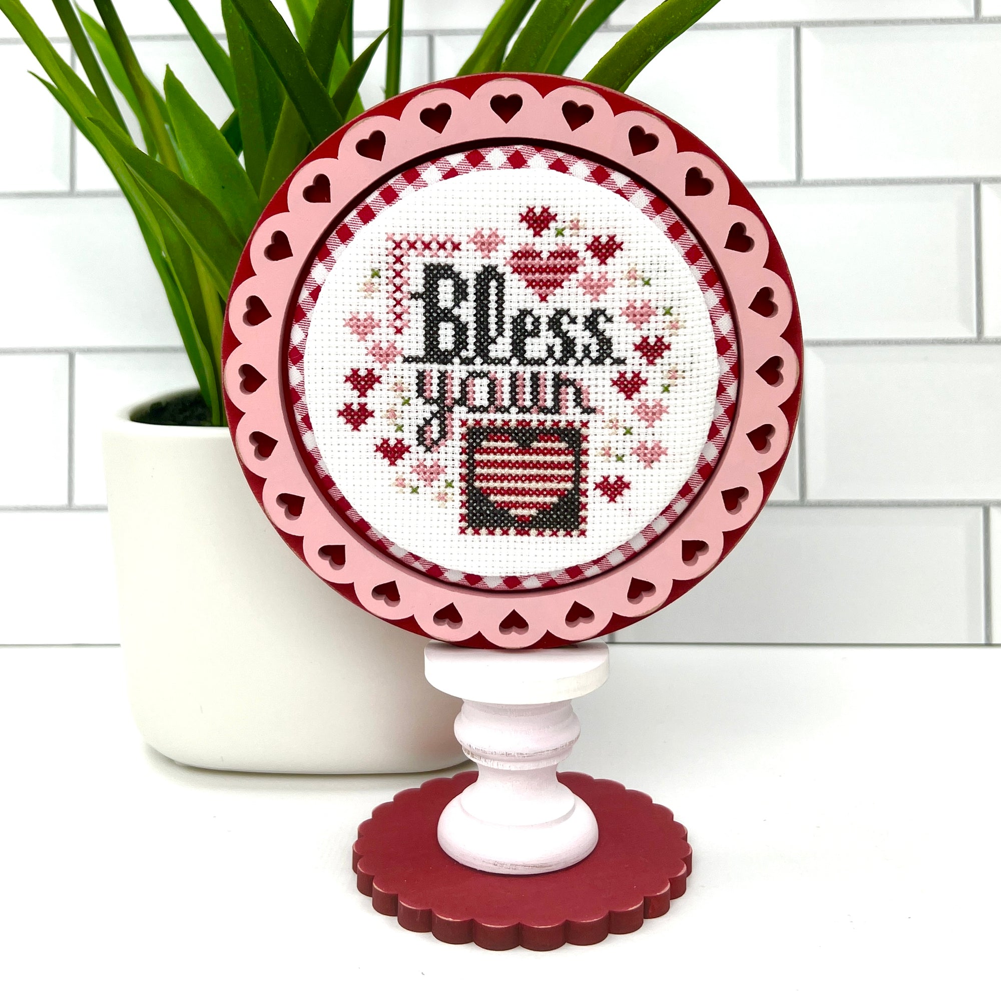 Wood round decorative frame with hearts for displaying a finished cross stitch piece 