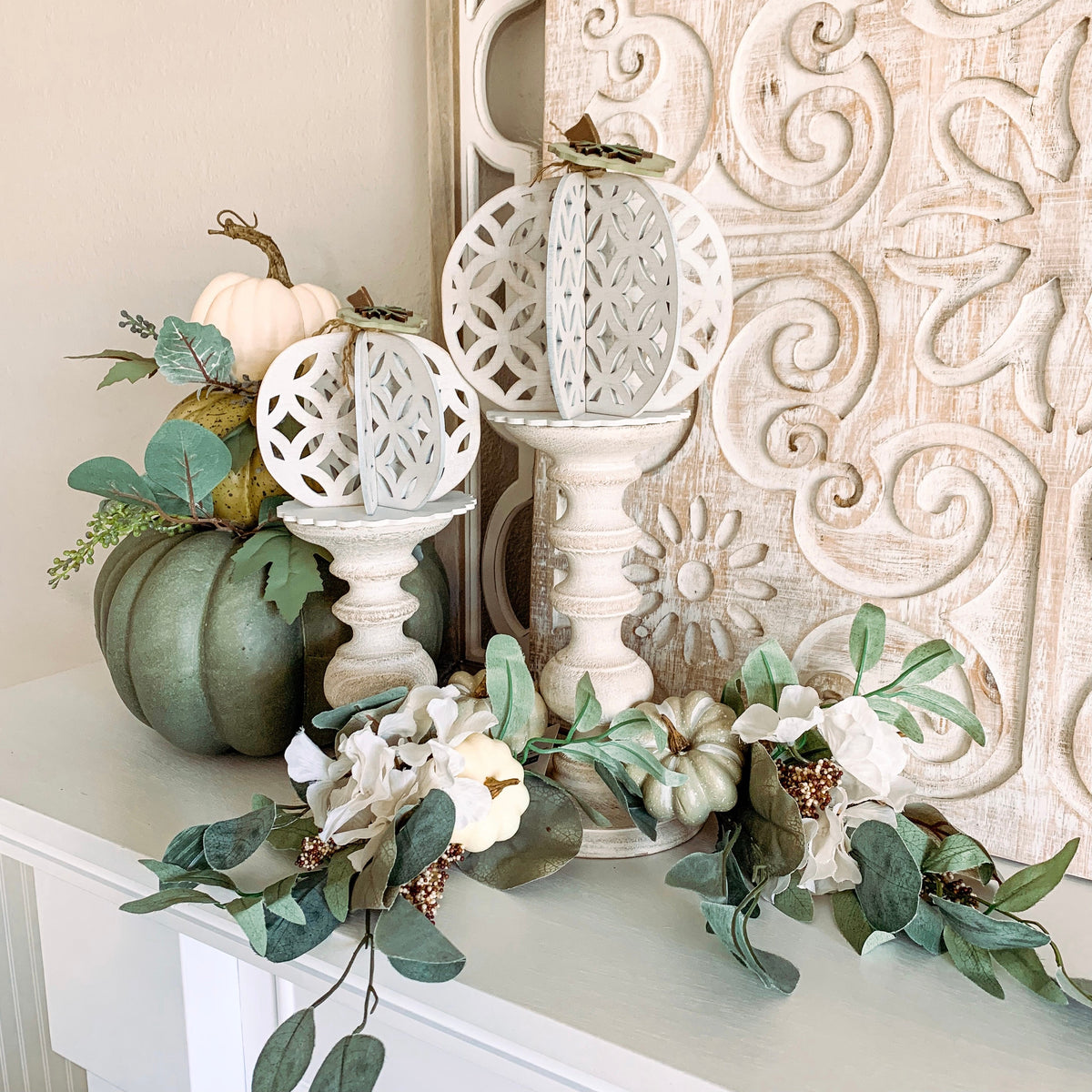 3D wood pumpkins, laser cut and painted white.