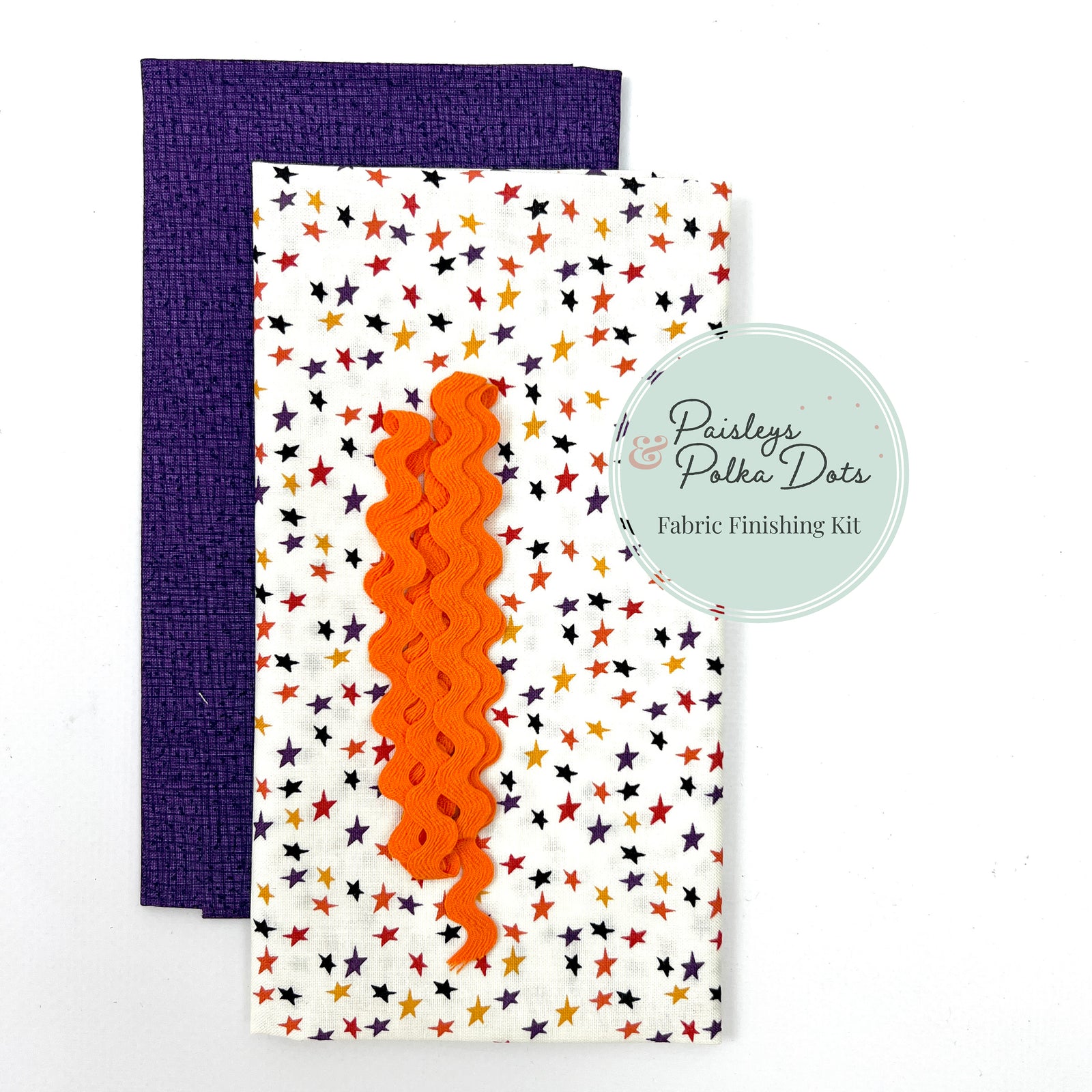 Fabric finishing kit with star pattern  and royal purple thatched fabric and orange ric-rac trim