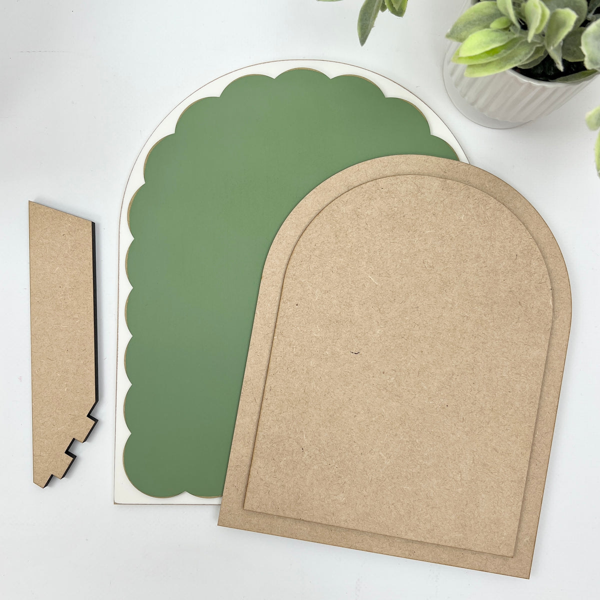 Arbor cross stitch display components — pre-painted sage scalloped arch board, two MDF arched finishing boards, and a stand.