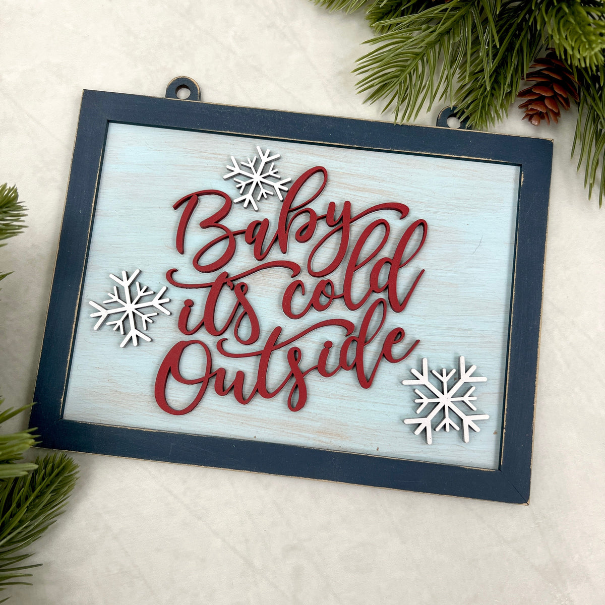 wood winter sign that says baby it&#39;s cold outside