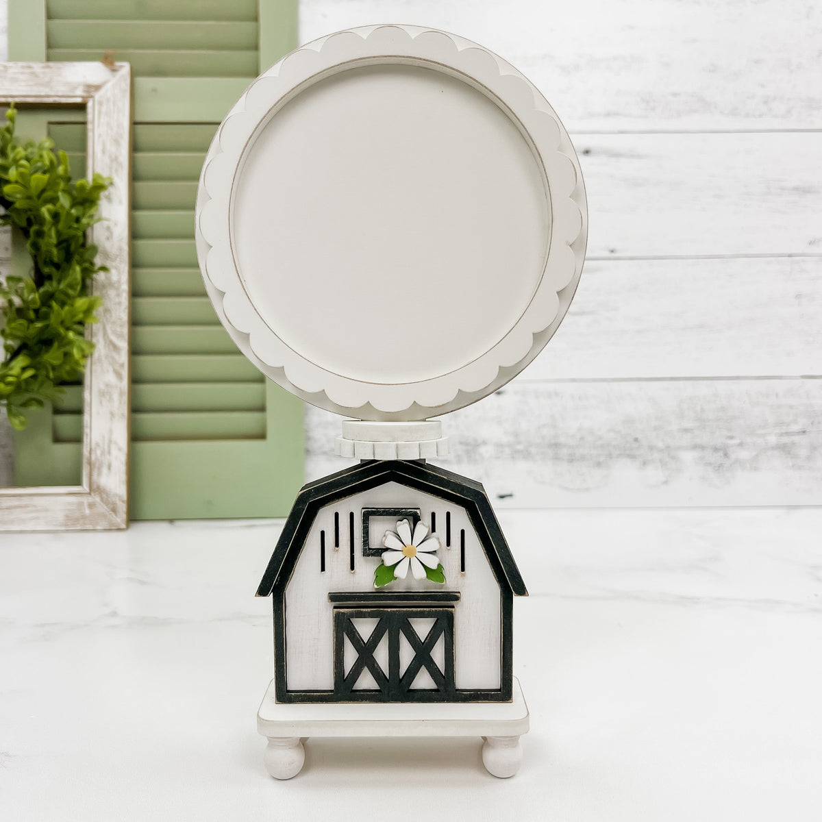 Balck and white wood barn cross stitch backer for displaying finished cross stitched pieces