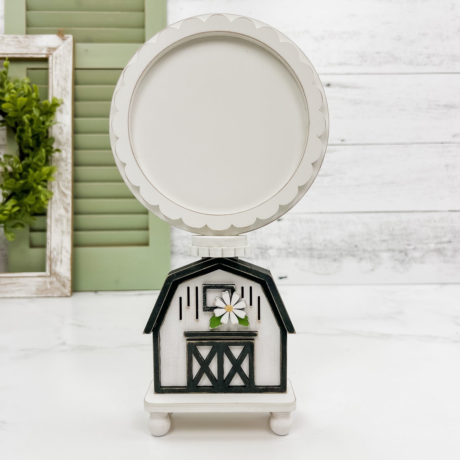 Balck and white wood barn cross stitch backer for displaying finished cross stitched pieces