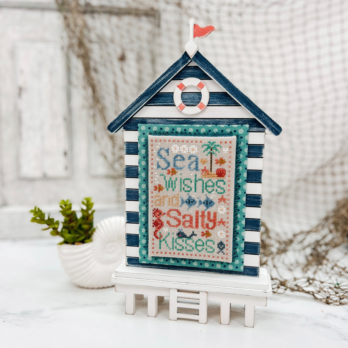 Laser cut unfinished wood beach house cross stitch display for coastal and nautical themed stitching