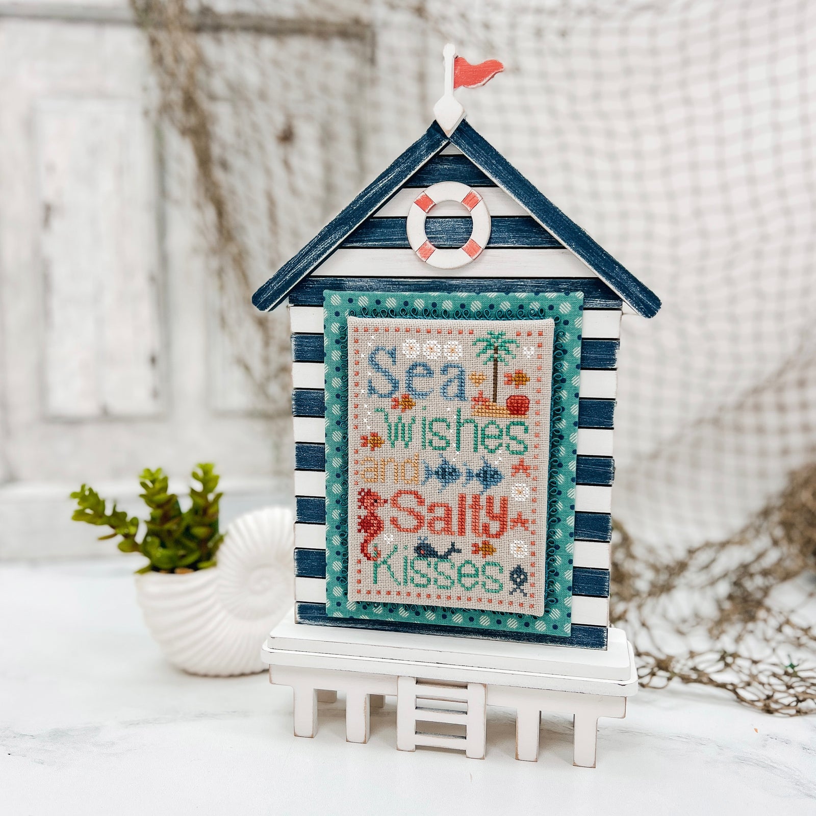 Laser cut unfinished wood beach house cross stitch display for coastal and nautical themed stitching