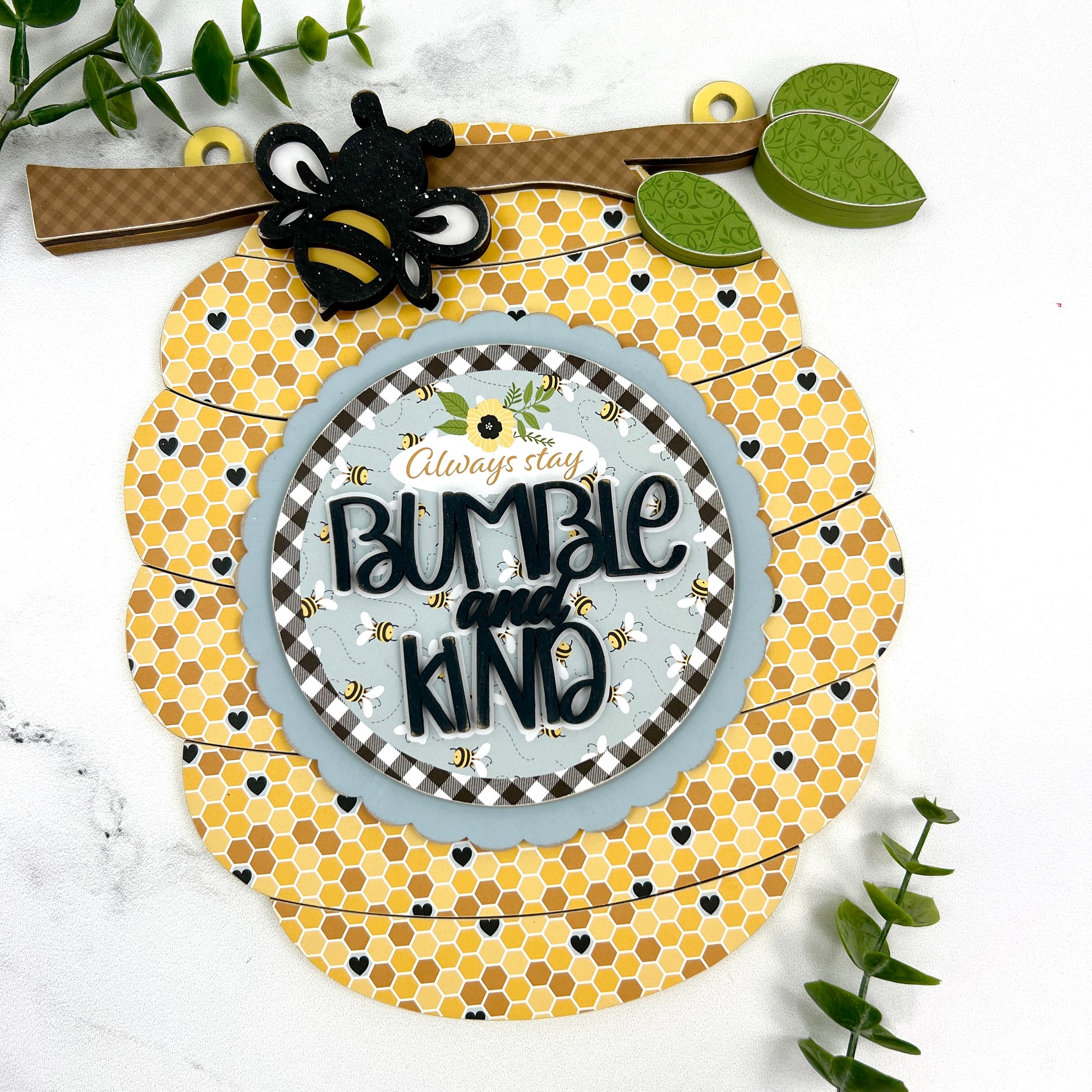Bee hive wood decor sign with a title that says Bumble and Kind. DIY wood craft kit