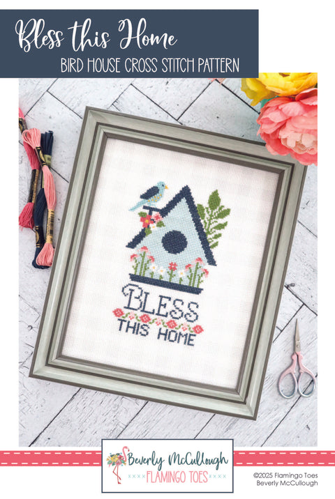Bird house cross stitch pattern with floral elements and text 'Bless this Home' and a blue bird