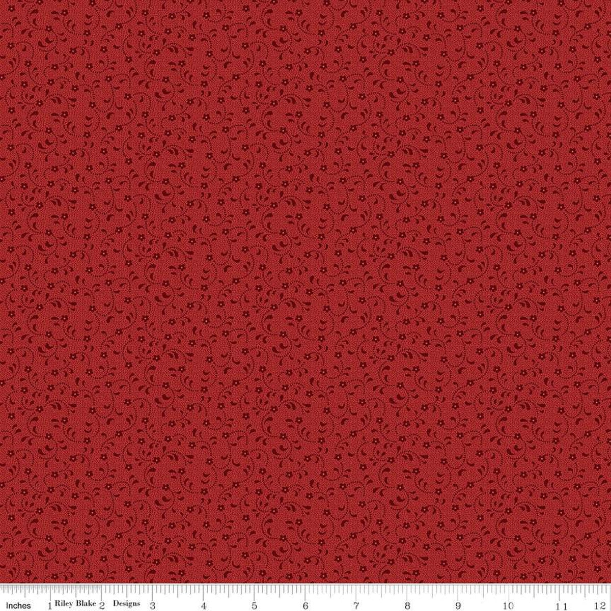 Red fabric with small blackish floral vine print