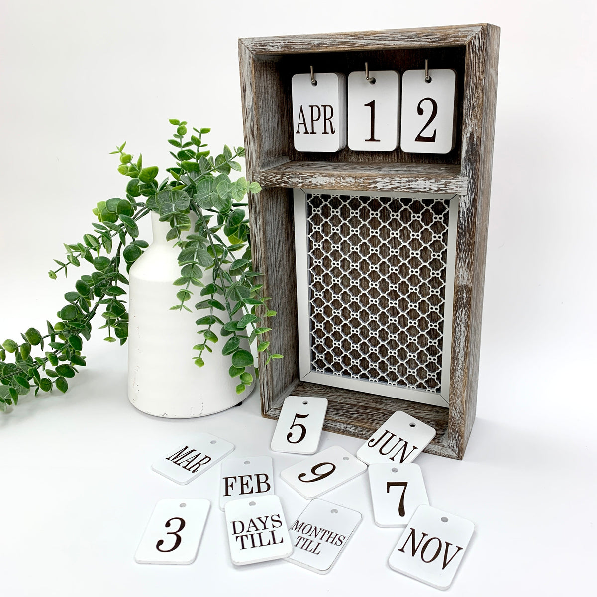 Changing seasonal calendar box with month and number tiles with lattice backinmg insert