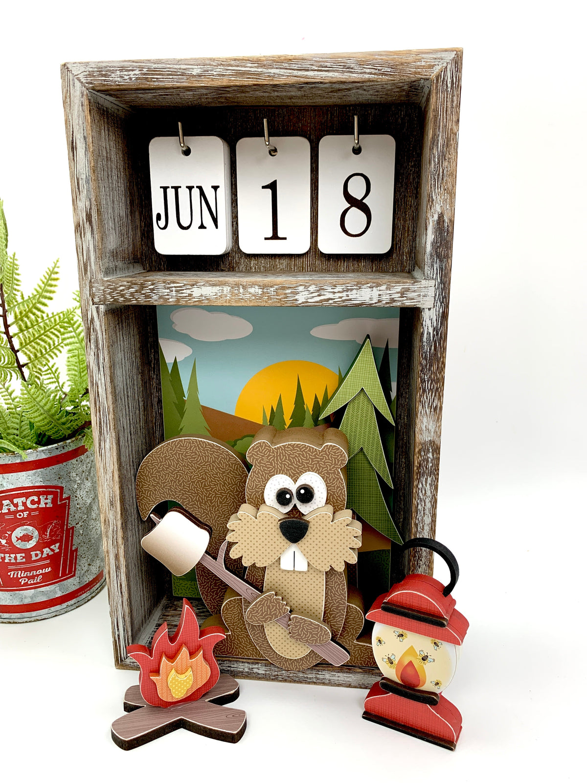 Perpetual calendar with woodland squirrel holding a marshmellow over a campfire