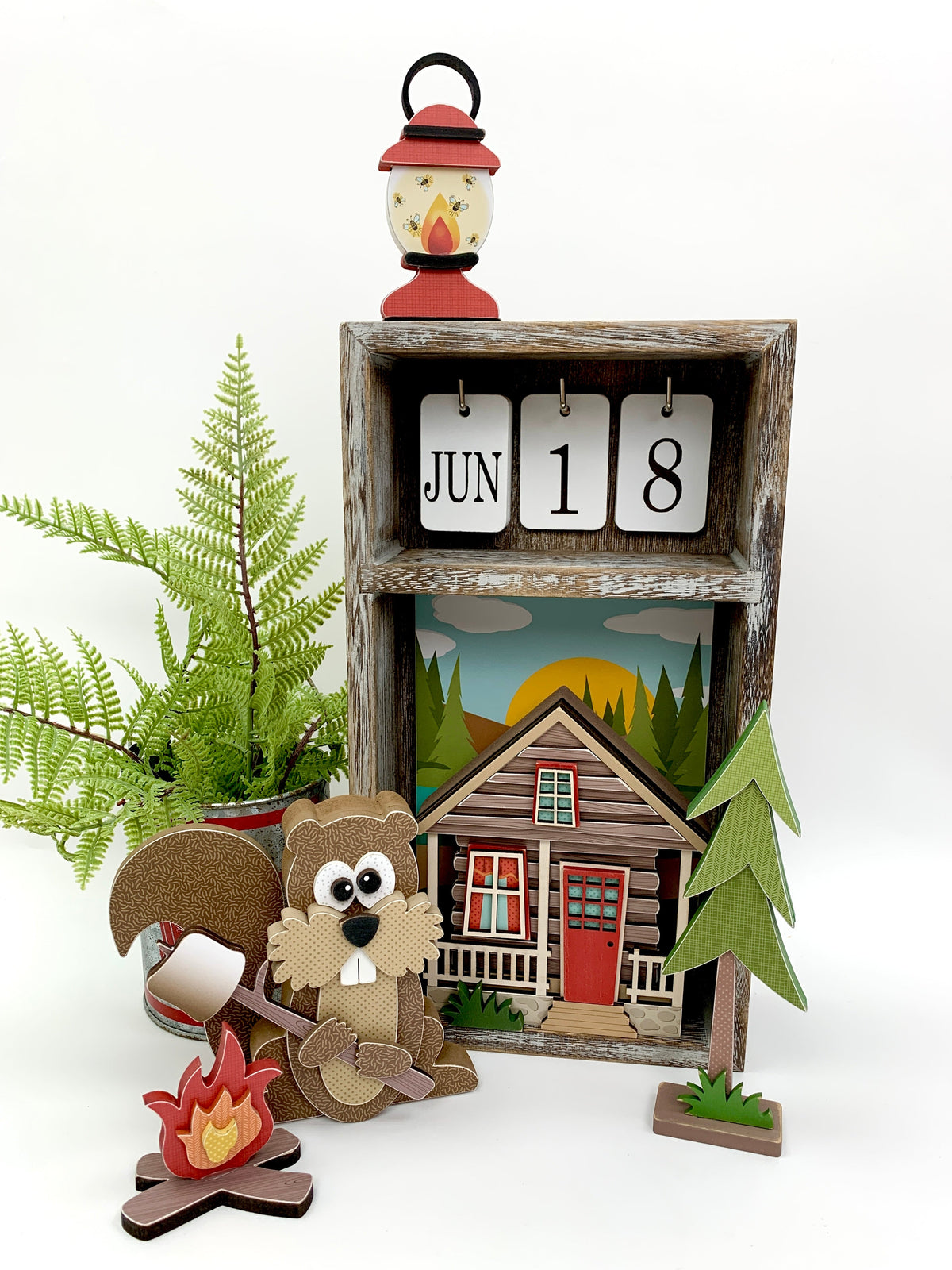 Outdoor themed wood decor kits; squirrel, cabin, campfire, and lantern