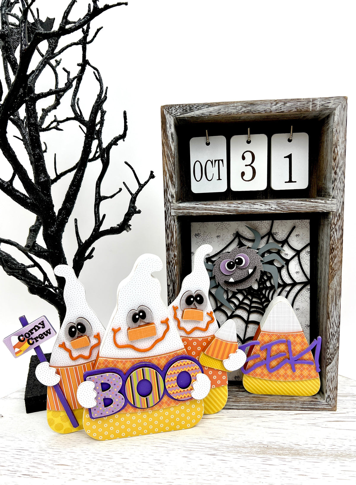 Calendar box with spider web, spider, candy corn EEK, and a set of 3 ghosts that look like candy corn.