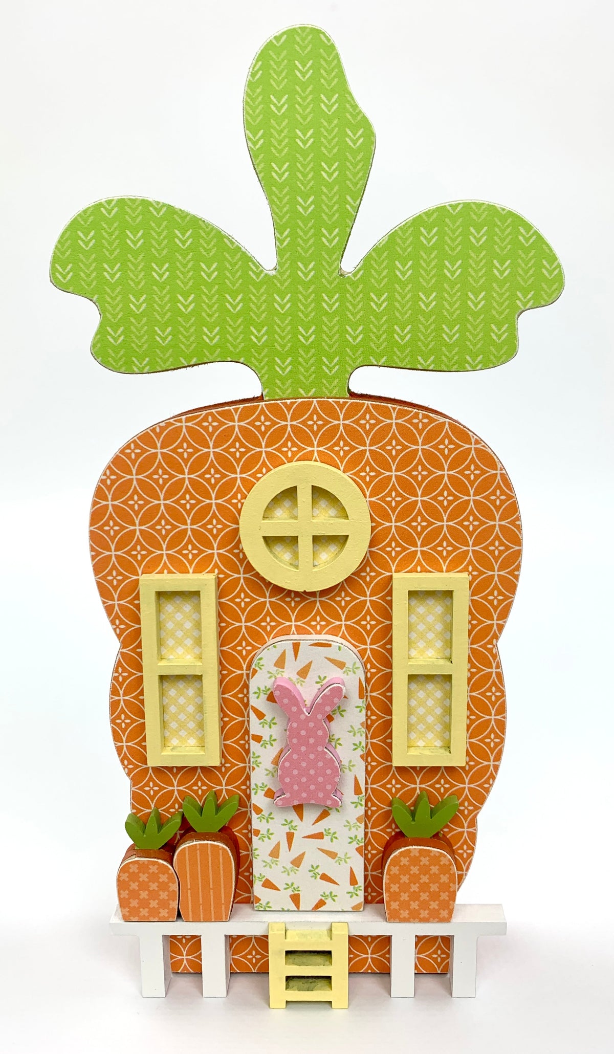 Orange carrot house with windows and porch Easter decoration.