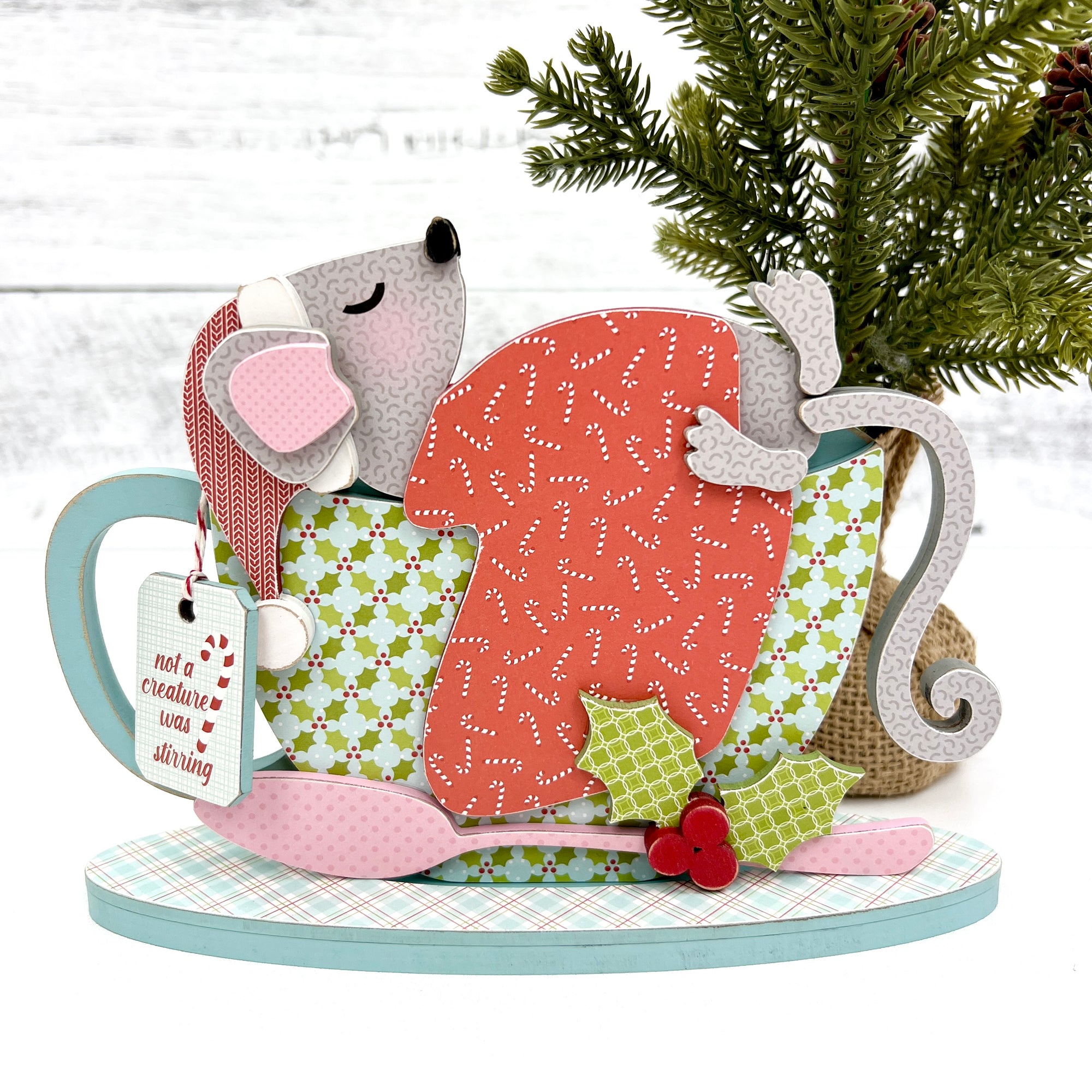 wood craft kit with a Christmas mouse sleeping in a teacup. Wood decor for styling tiered trays and shelves.