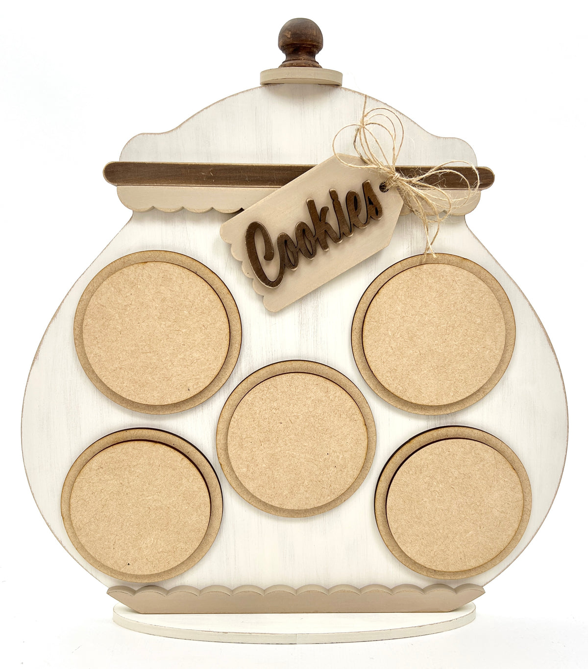 Whimsical unfinished wood cookie jar shaped cross stitch display with round circles for interchangeable stitched designs and decorative tag.