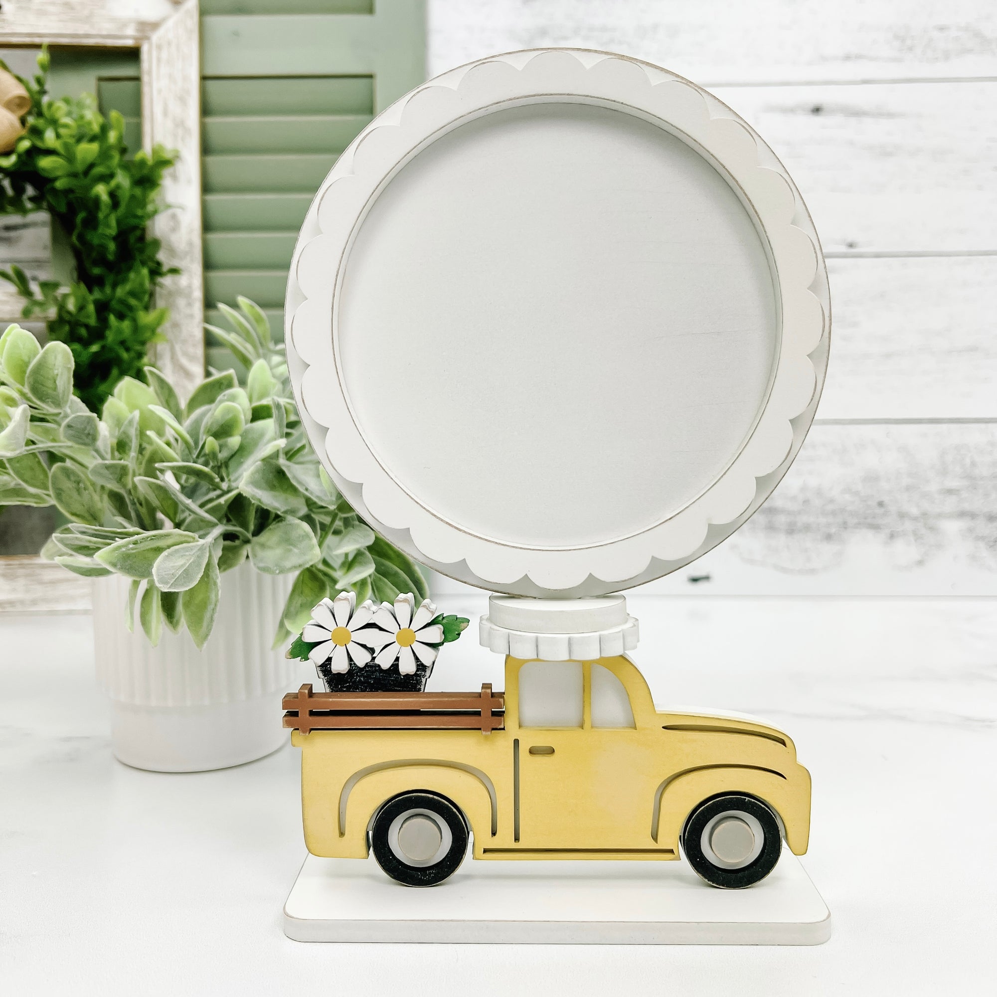 Yellow wood pick up truck with daisies cross stitch display frame