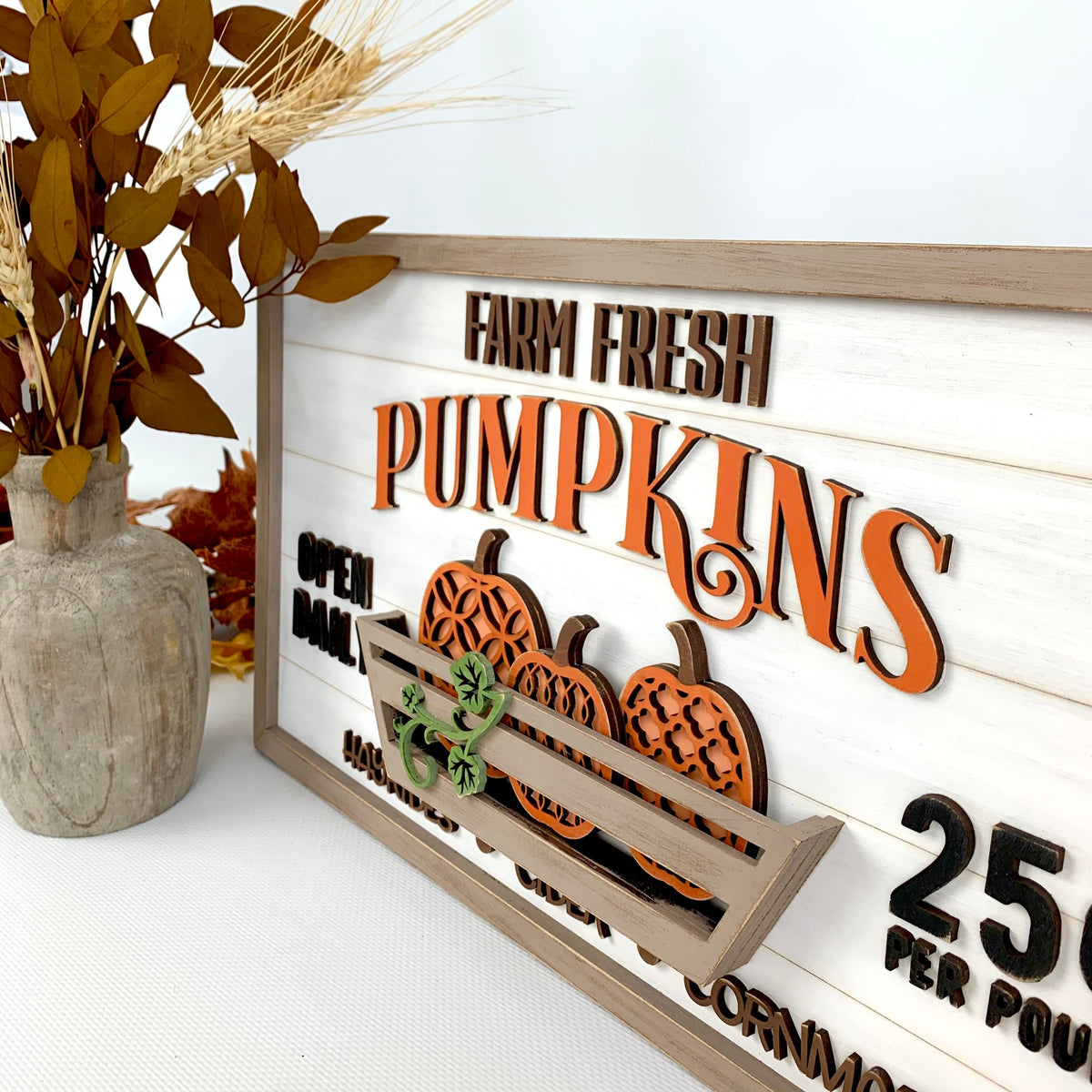 Fresh Pumkins wood shiplap sign decoration for a mantel, countertop, or shelf. Sign with pumpkins in a basket. Farm fresh pumpkins wood sign for fall decorating. Side view