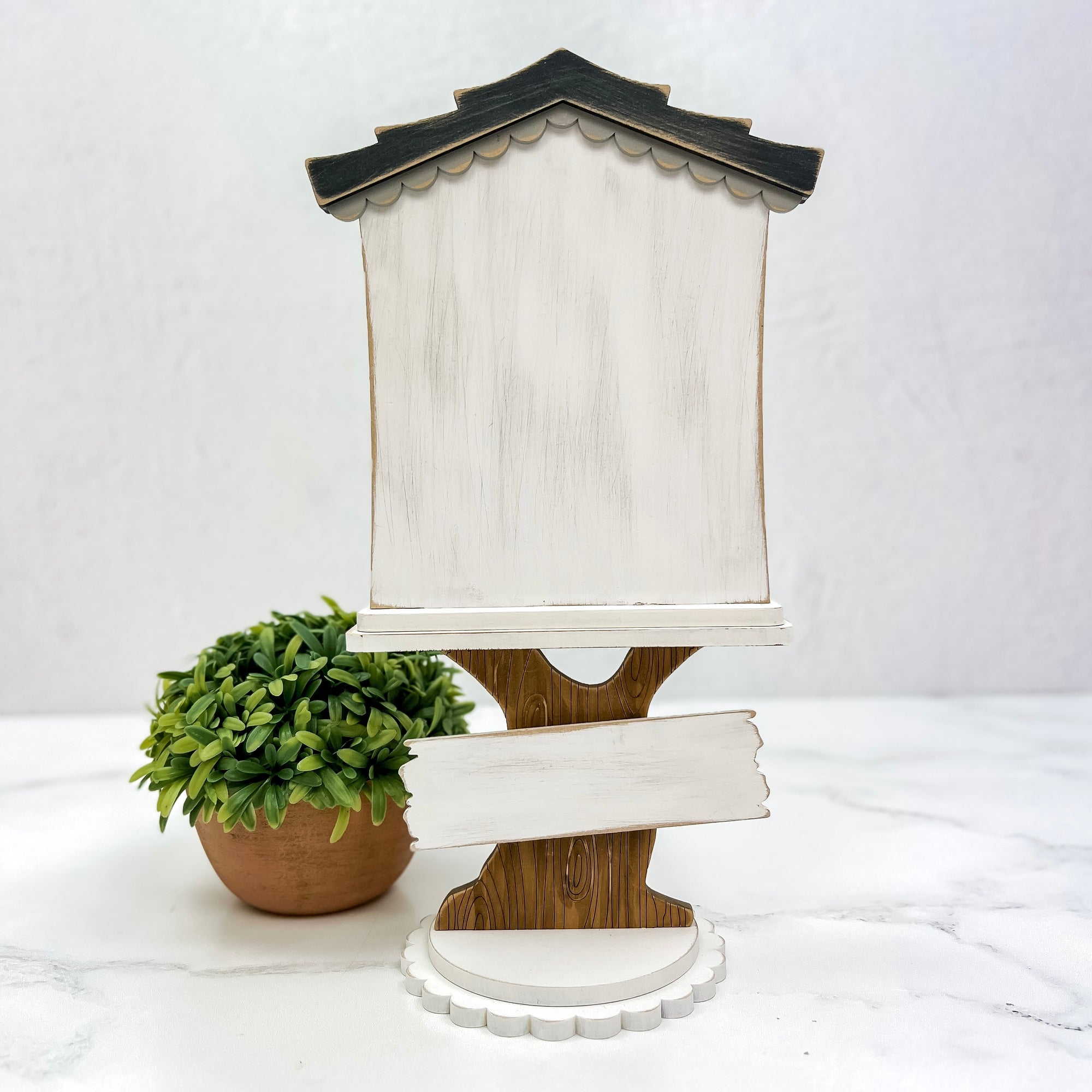 wood Cross Stitch Display shaped like a birdhouse with a tree base.