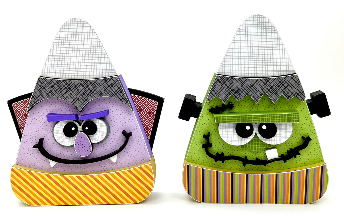 Candy corn shaped wood decorations designed to look like Frankenstein and Dracula wood craft kits