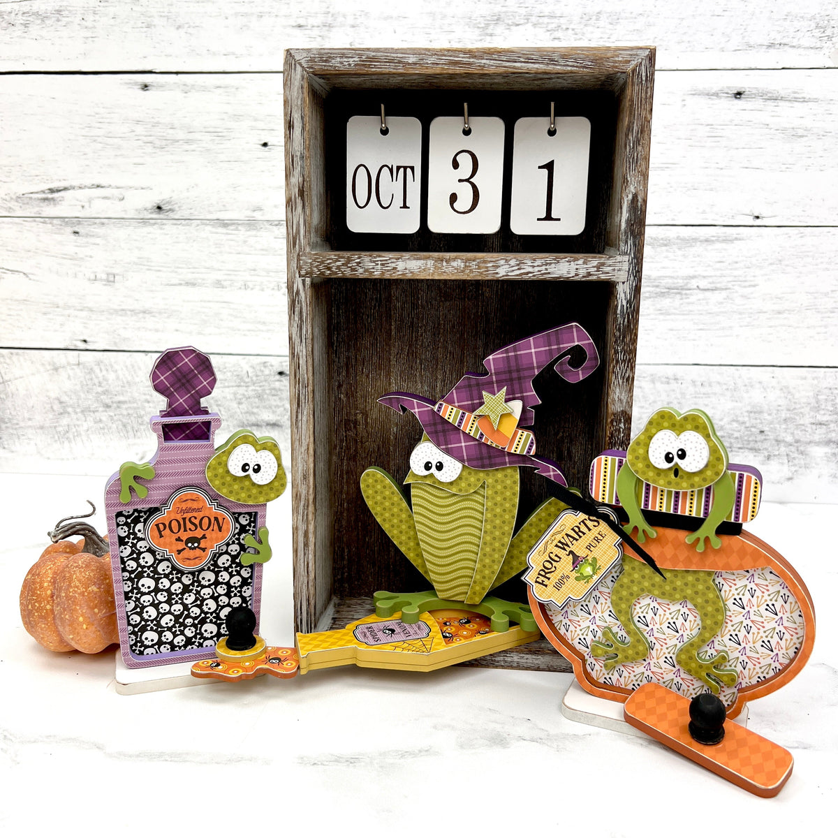 halloween toads in potion bottles DIY wood craft kits. Shown in a calendar box.
