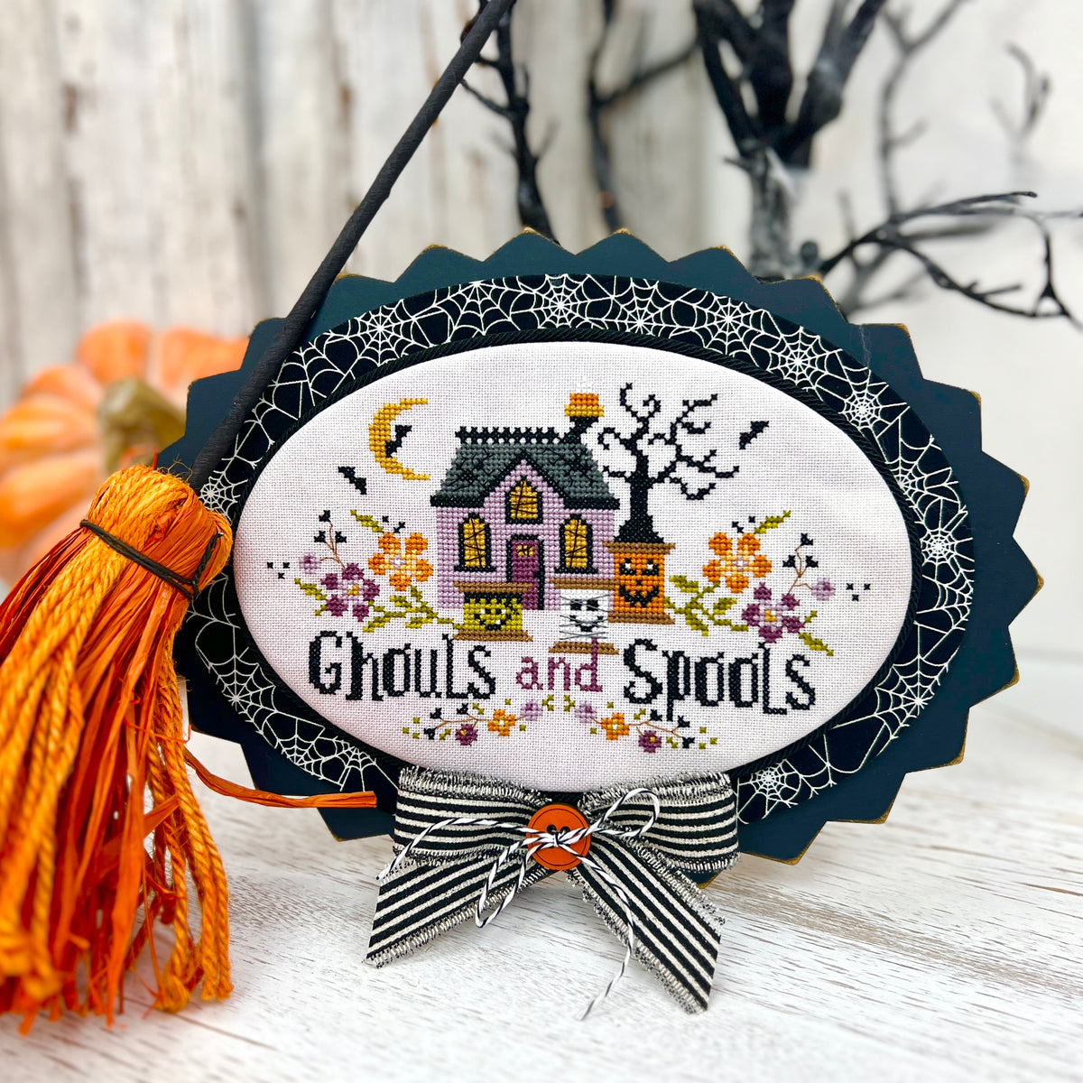 Ghouls and Spools Halloween cross stitch pattern with spooky house pumpkins bats and floral details