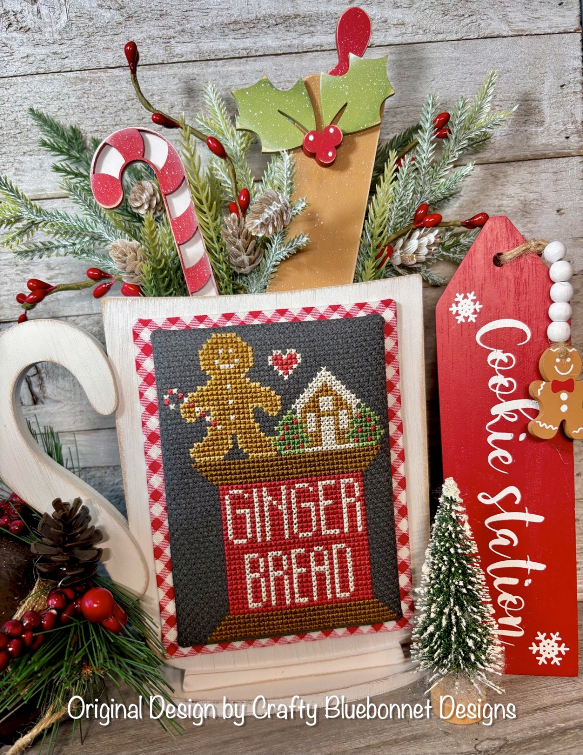 Decorative Christmas Mug with gingerbread-themed baking items on a spool of thread with a candy cane and rolling pin