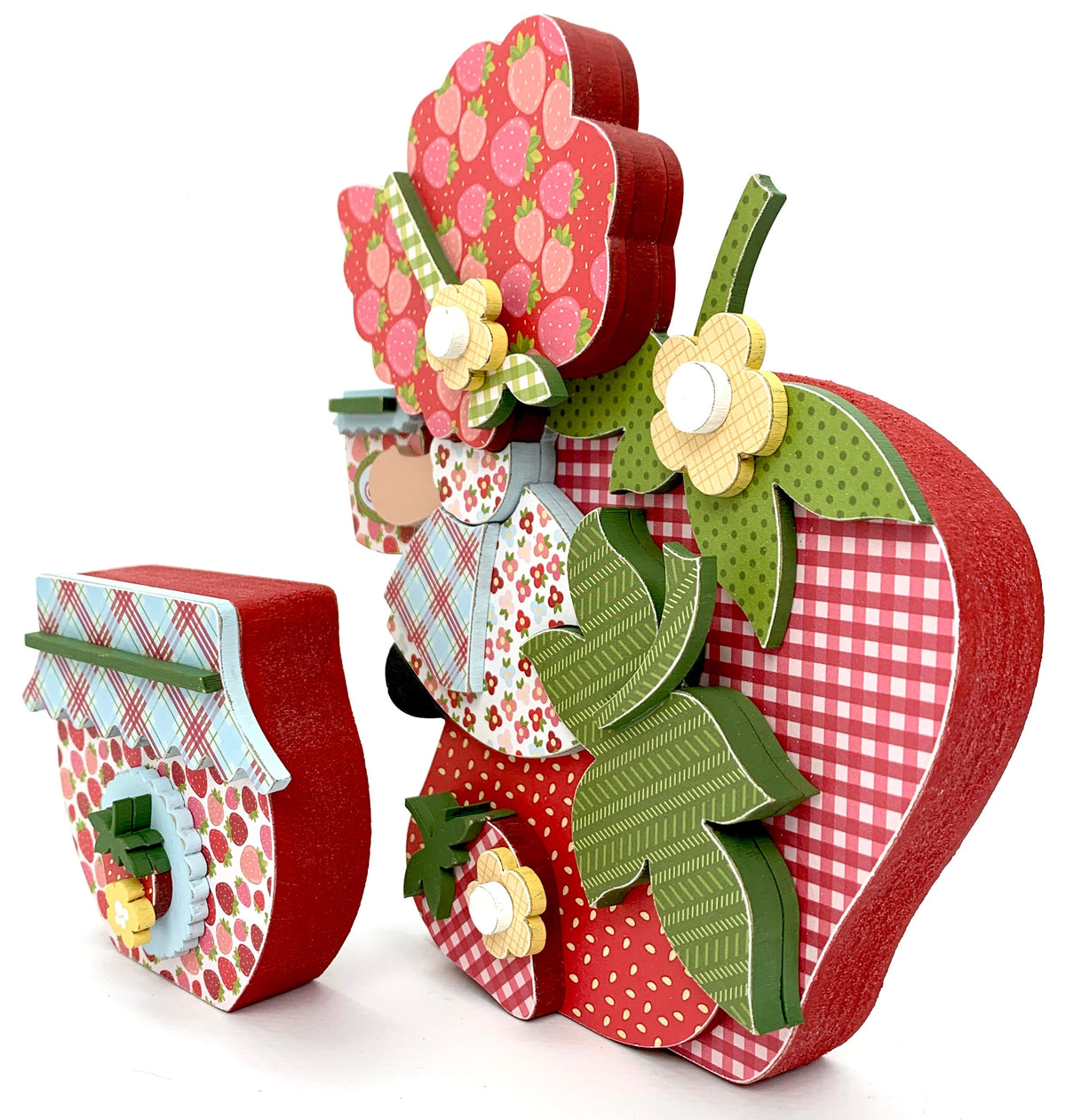 Strawberry shortcake inspired wood decor craft kit with a girl sitting on a strawberry holding a jam jar. 
