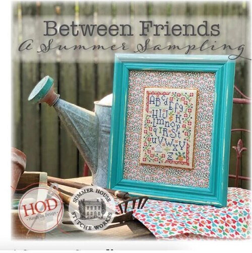 cross-stitched collection of summer samplers and seed packets for the garden