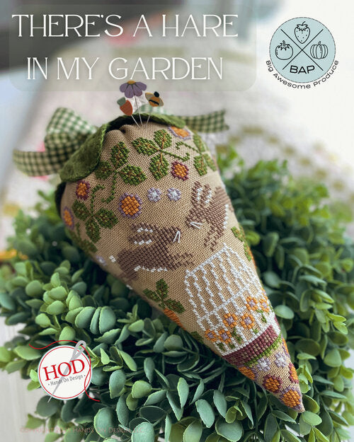 Cross stitch big awesome produce with a rabbit hare design in a garden of spring flowers 