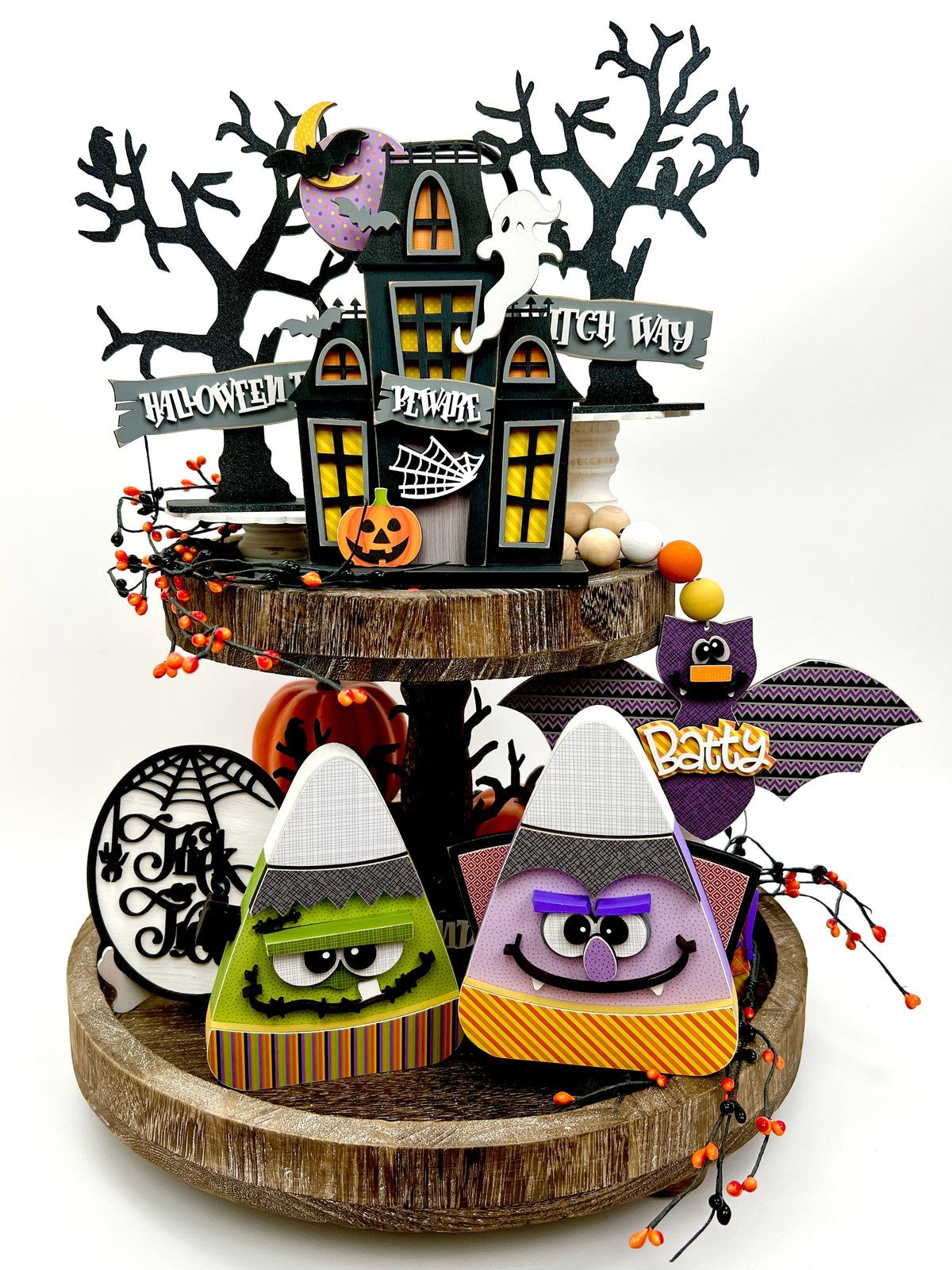 Halloween tiered tray wood decorations with candy corn, haunted house, spooky trees, bat and trick or treat sign