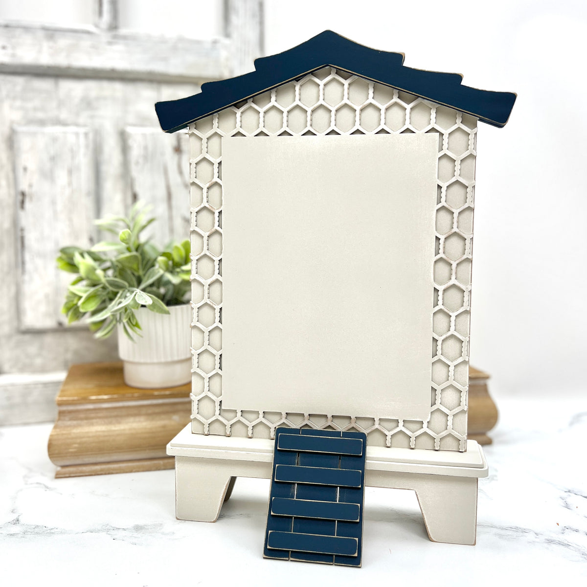 Farmhouse hen house wood cross stitch finishing display with honeycomb background, curved roofline, and ladder detail for country décor.