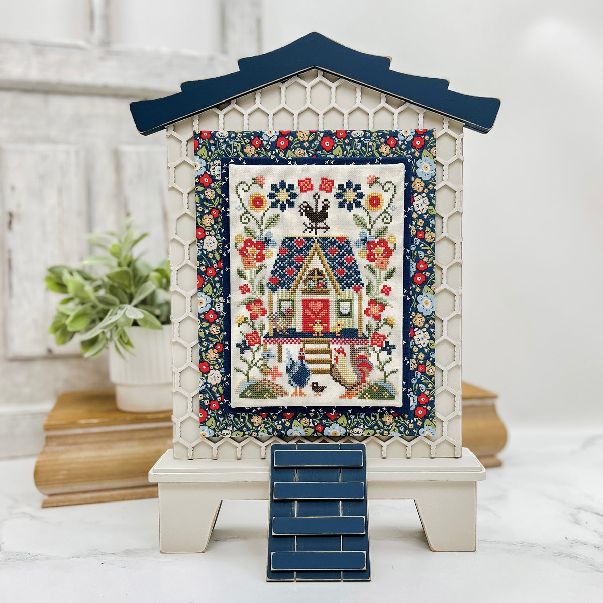 Farmhouse hen house wood cross stitch finishing display with honeycomb background, curved roof line, and ladder detail for country decor.