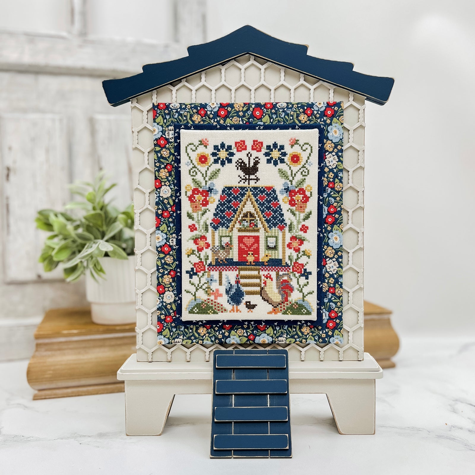 Farmhouse hen house wood cross stitch finishing display with honeycomb background, curved roof line, and ladder detail for country decor.