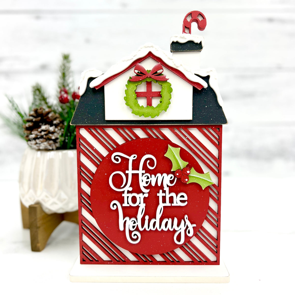 Christmas house with a title that says Home for the holidays