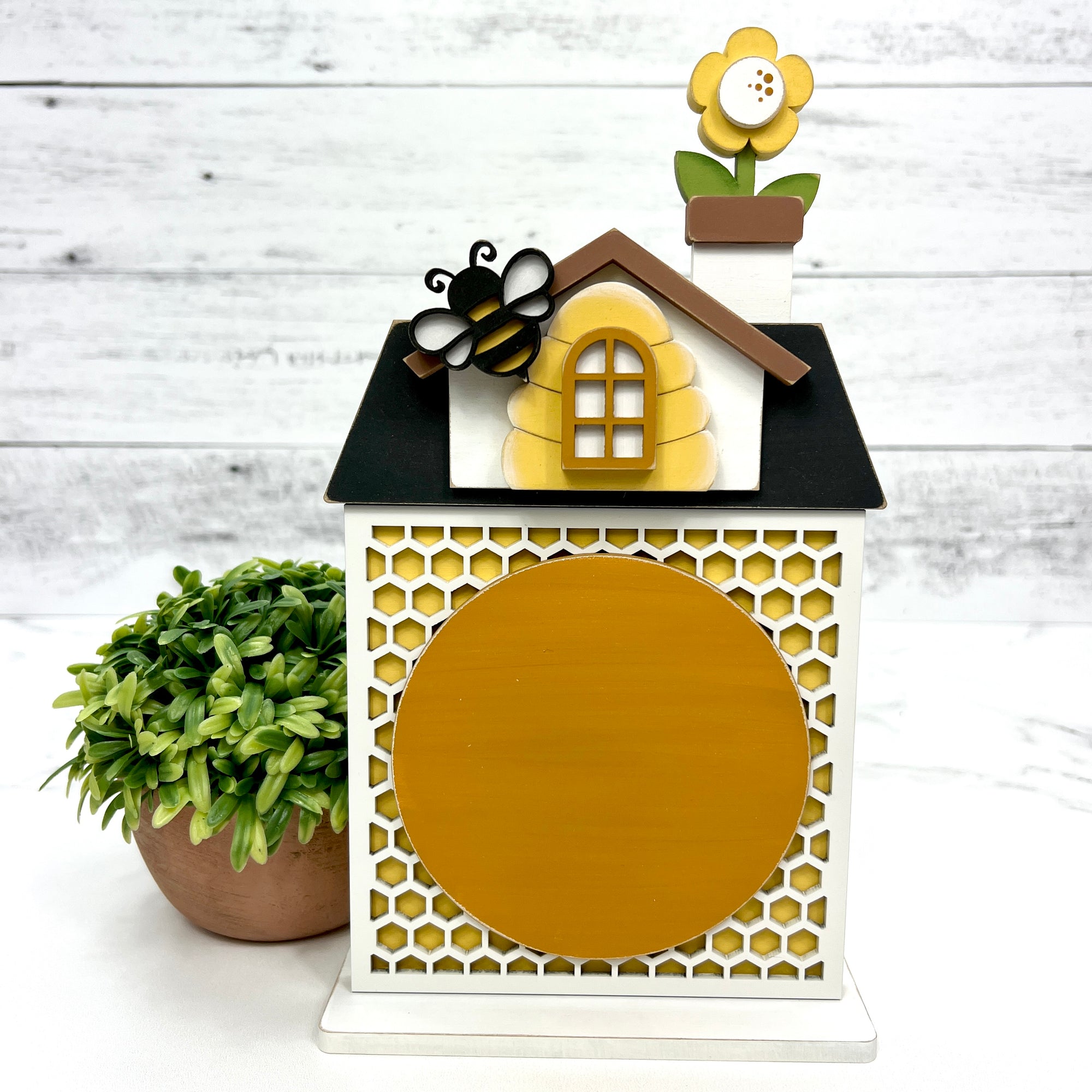 Honey bee themed house with honeycomb backing for displaying a finished cross stitch piece