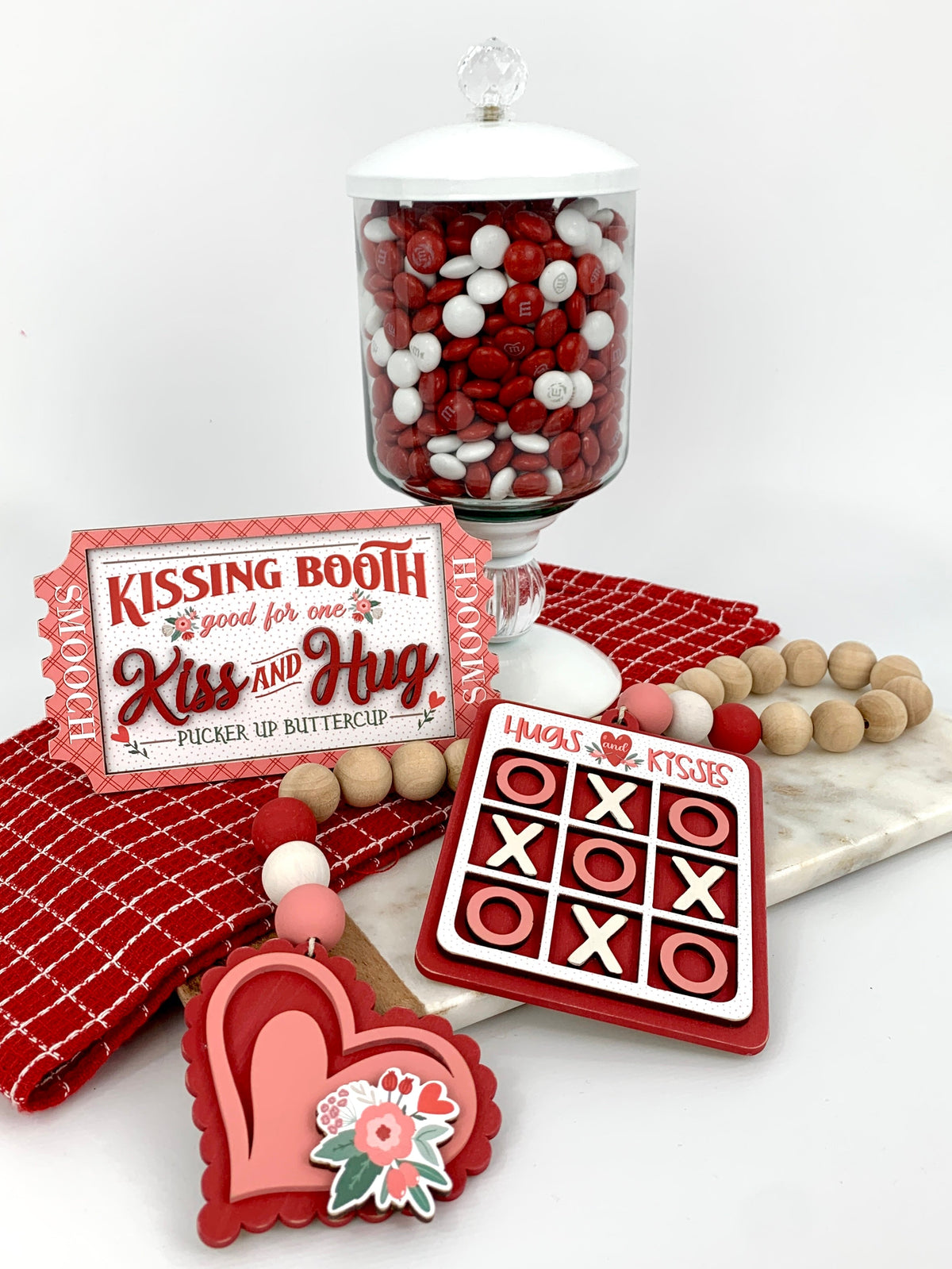 Smooch ticket, red and pink layered heart, hugs and kisses tic tac toe wood beaded garland with a candy jar.  Valentine wood decorations.