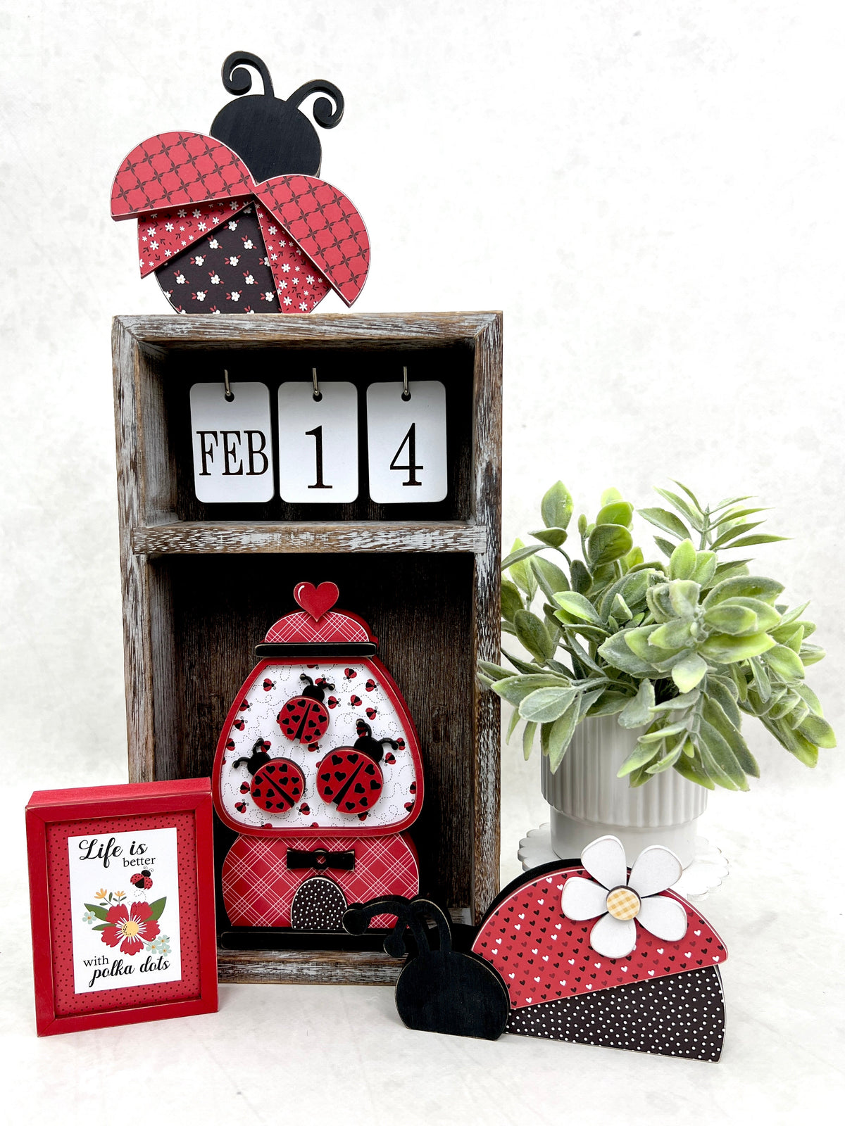Calendar box decorated with black and red wood ladybugs. DIY wood craft kit.
