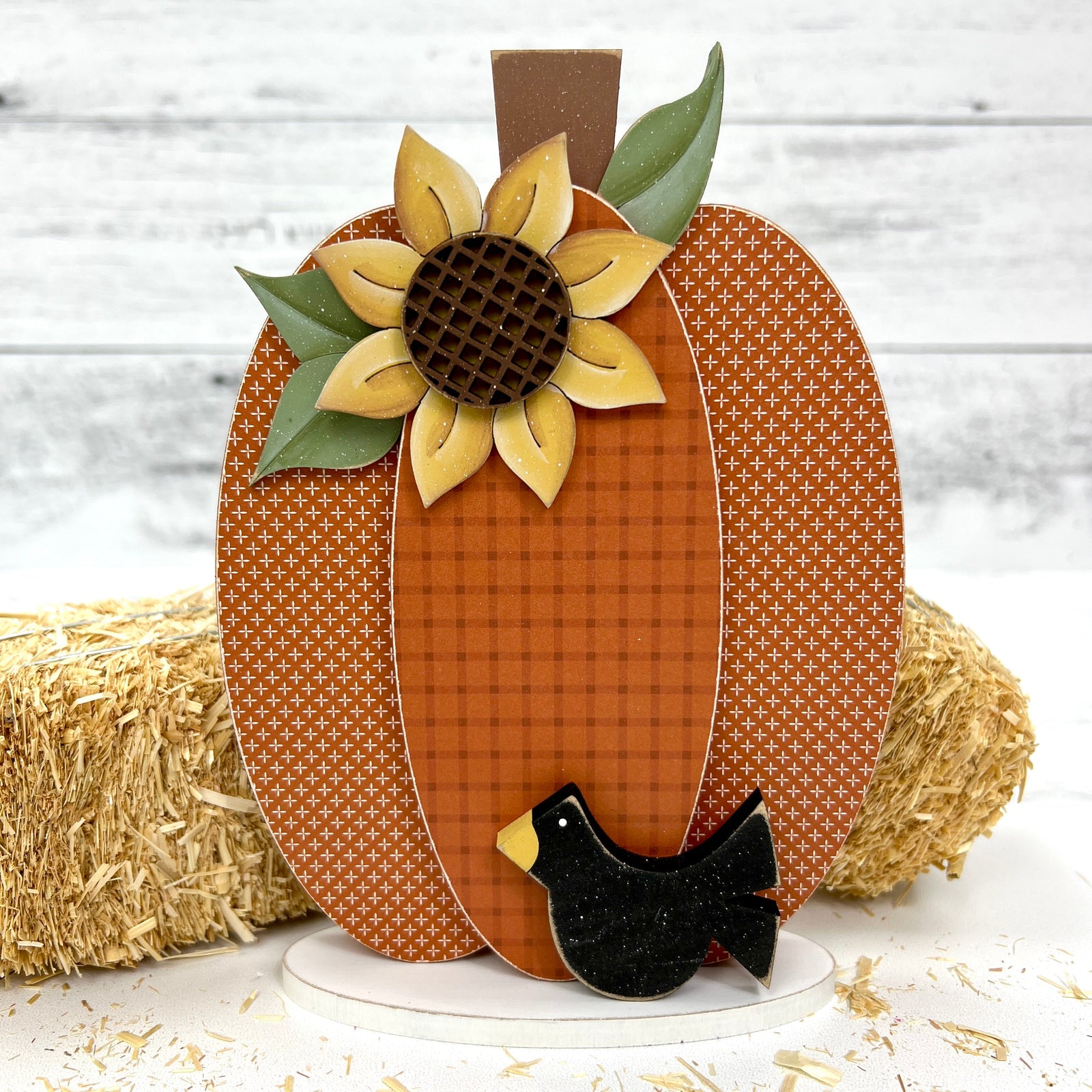 Large fall pumpkin wood decor craft kit with a sunflower, black crow, and with a plaid pumpkin