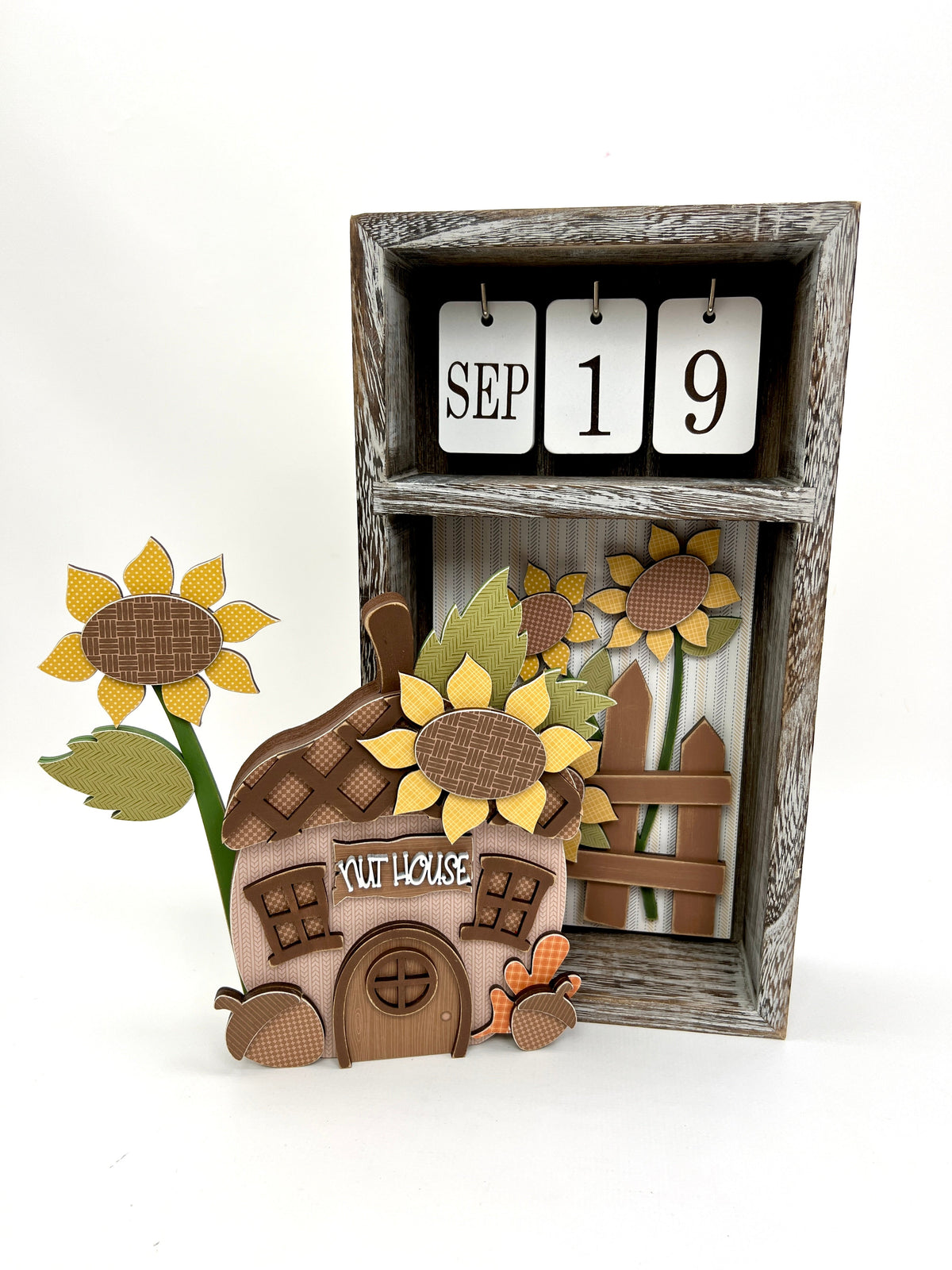 Seasonal calendar box with a nut house acorn and sunflowers wood decorations