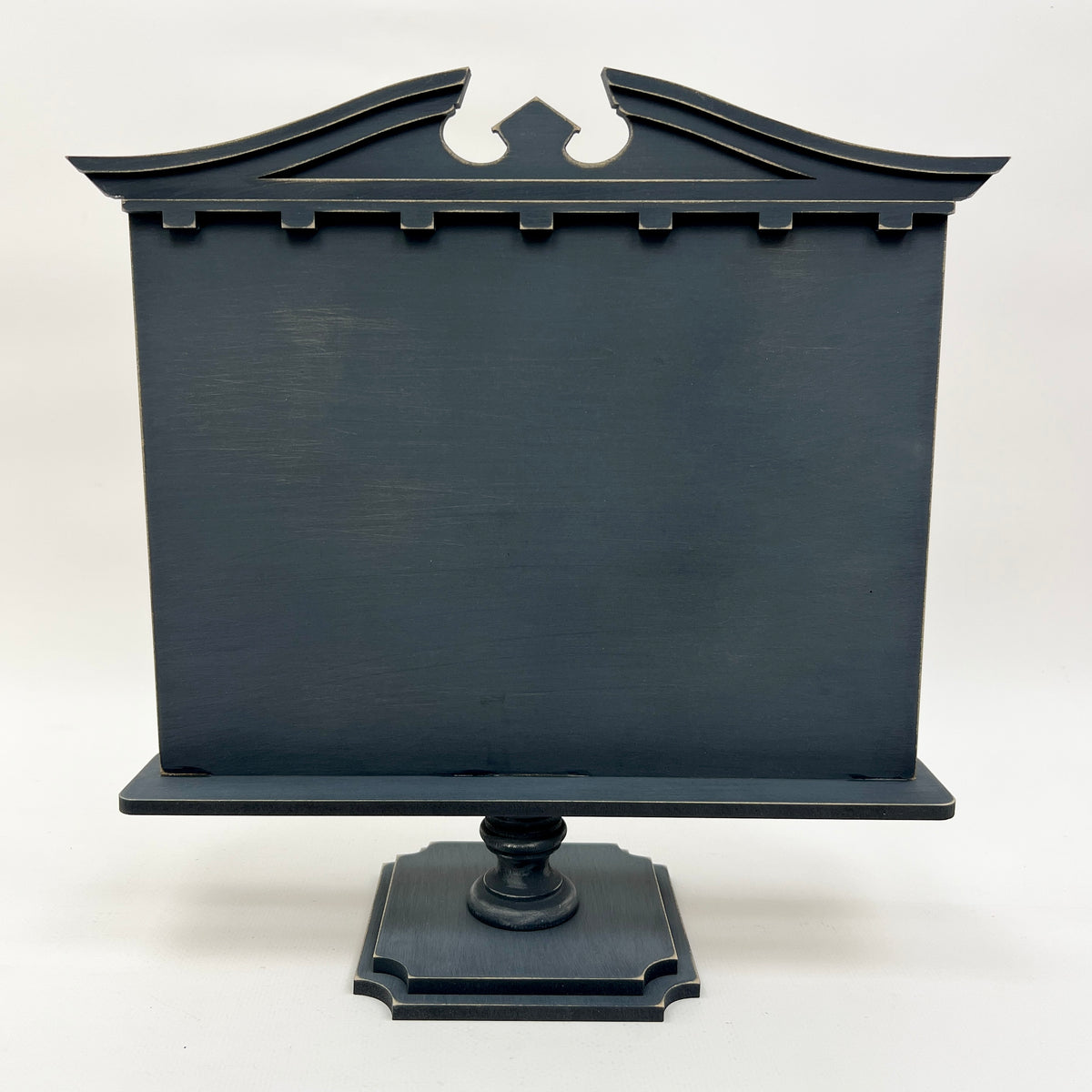 Unfinished wood pedestal frame called The Manor Frame, designed for cross stitch display