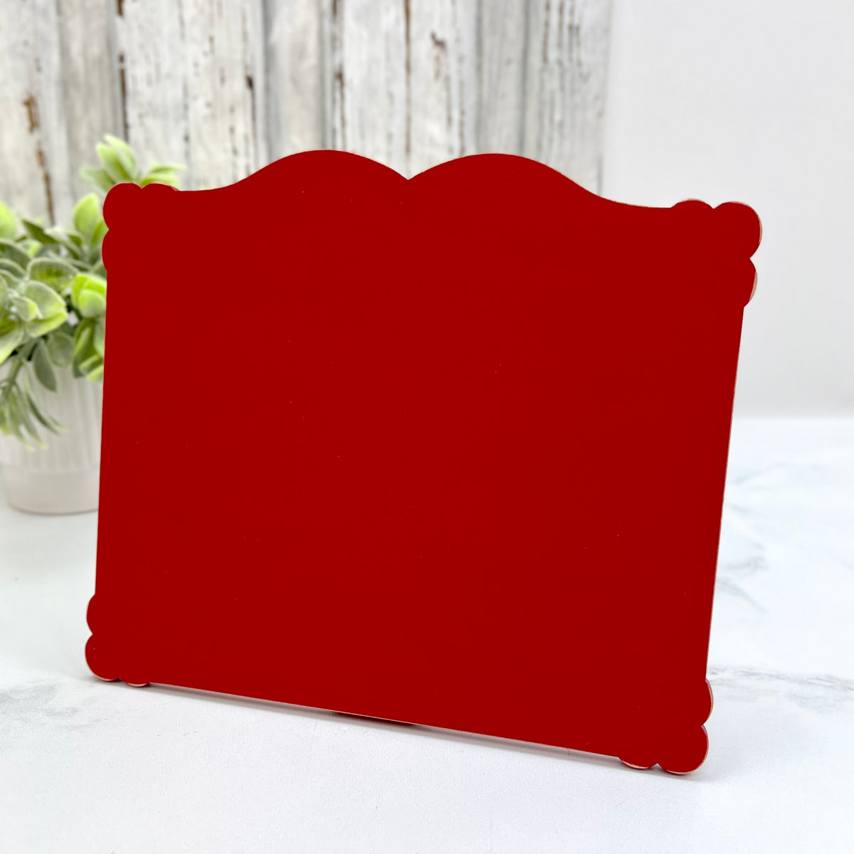 Medium Petal Edge Rectangle cross stitch display pre-painted in red with lightly distressed scalloped edges for finished cross stitch pieces up to 6.25 by 7.75 inches.