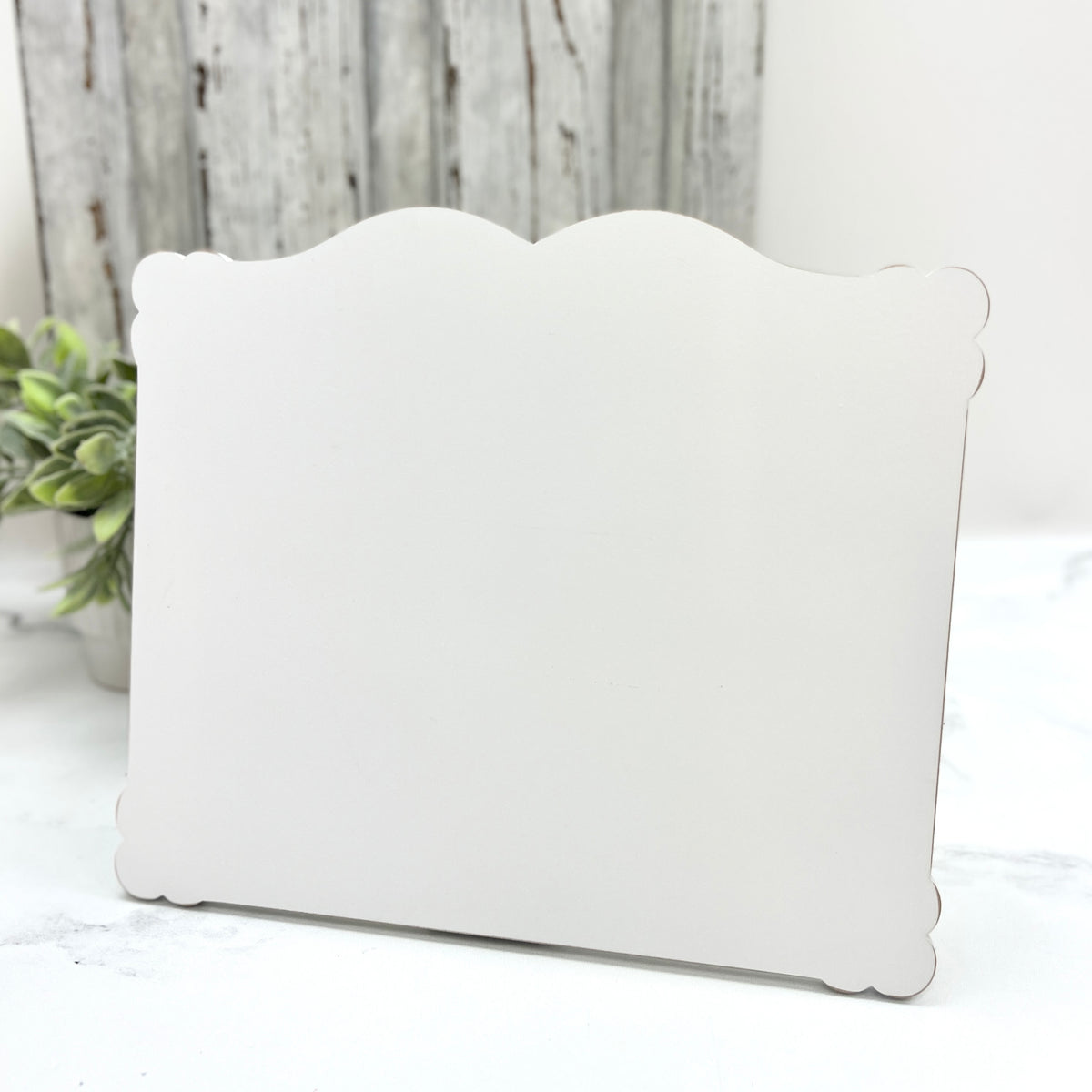 Medium Petal Edge Rectangle cross stitch display pre-painted in white with lightly distressed scalloped edges for finished cross stitch pieces up to 6.25 by 7.75 inches.