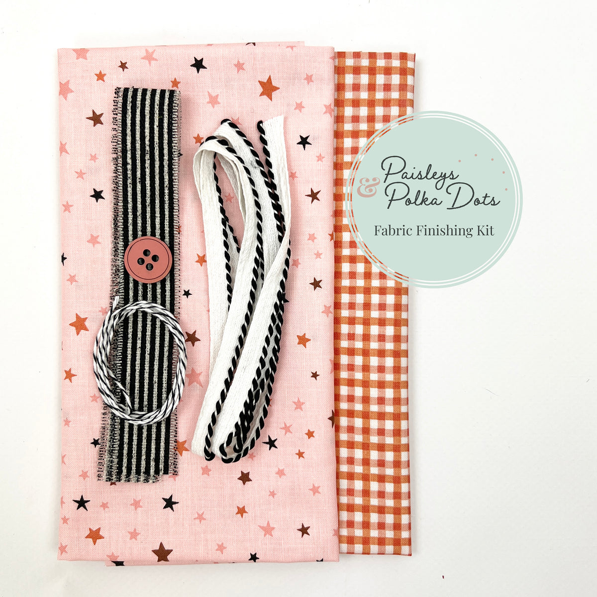 Pink stars and orange gingham cross stitch fabric finishing kit with coordinating black and white trims