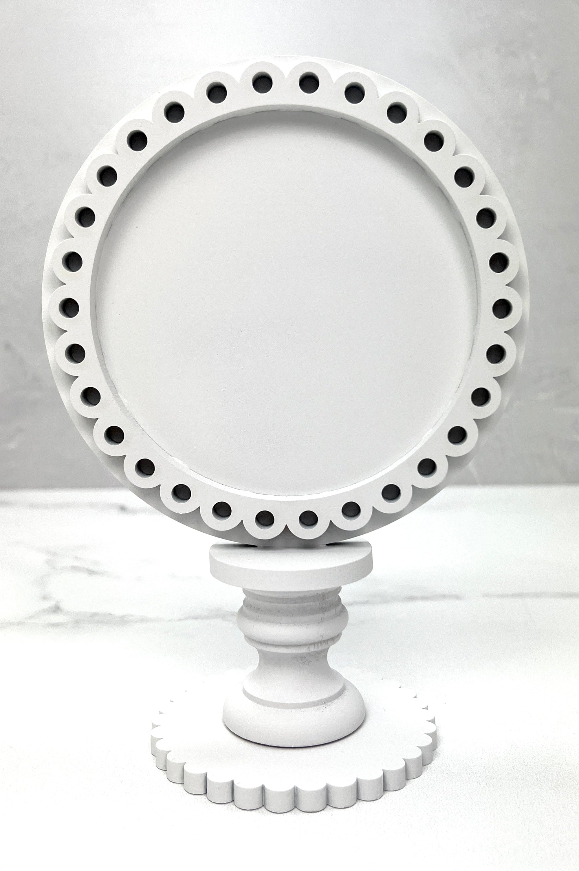 Round wood decorative frame for displaying cross stitch roundabouts.