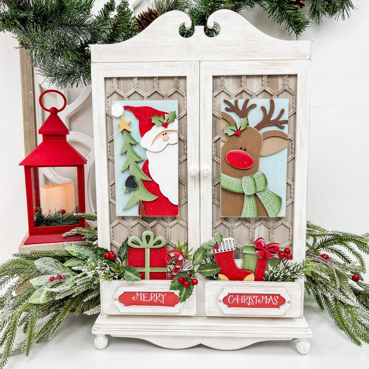 Country wood cabinet decor with santa and his reindeer peeking through the doors.  Wood craft kit.