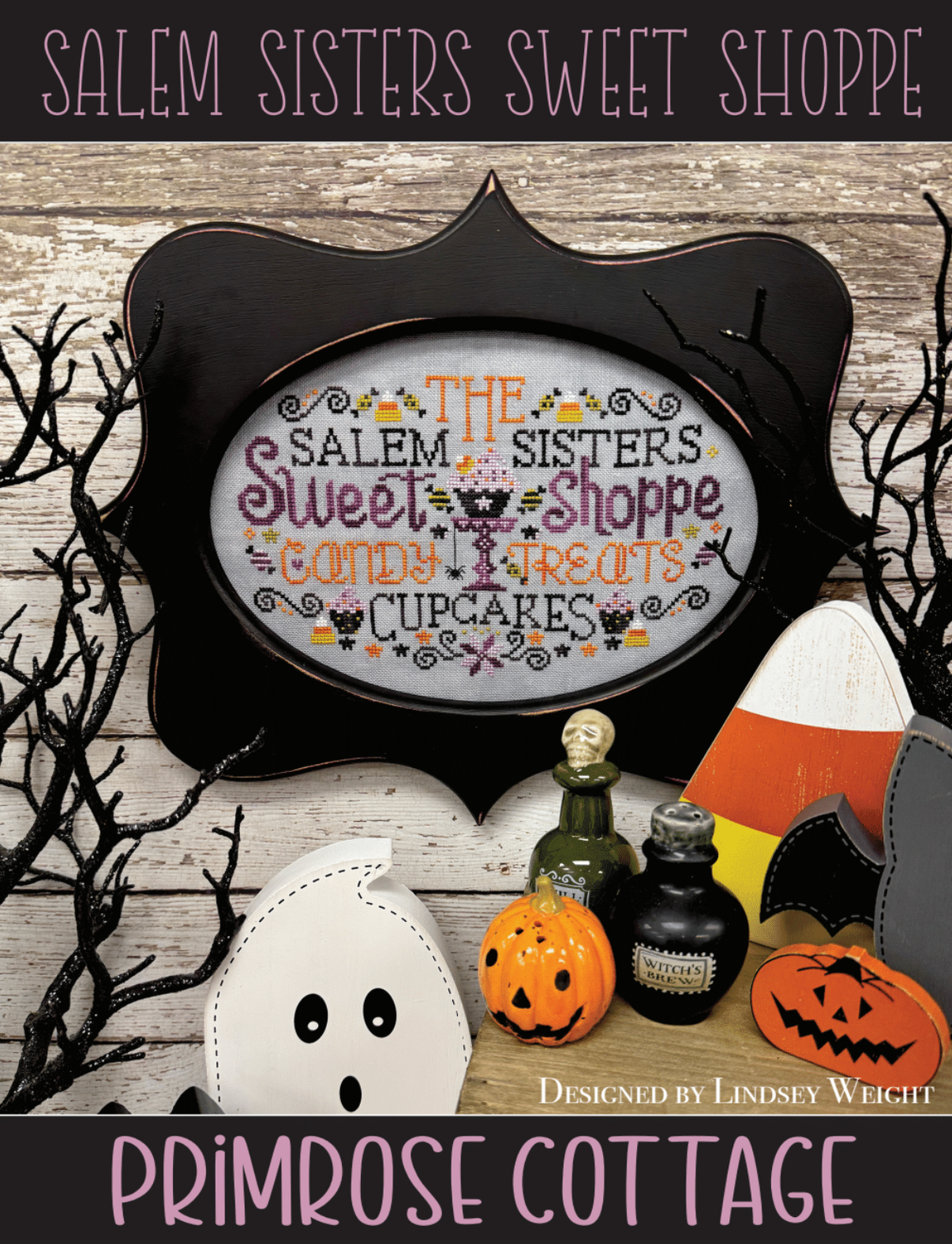 Halloween-themed cross-stitch design with text 'The Salem Sisters Sweet Shoppe' with candy treats and cupcakes with candy corns.